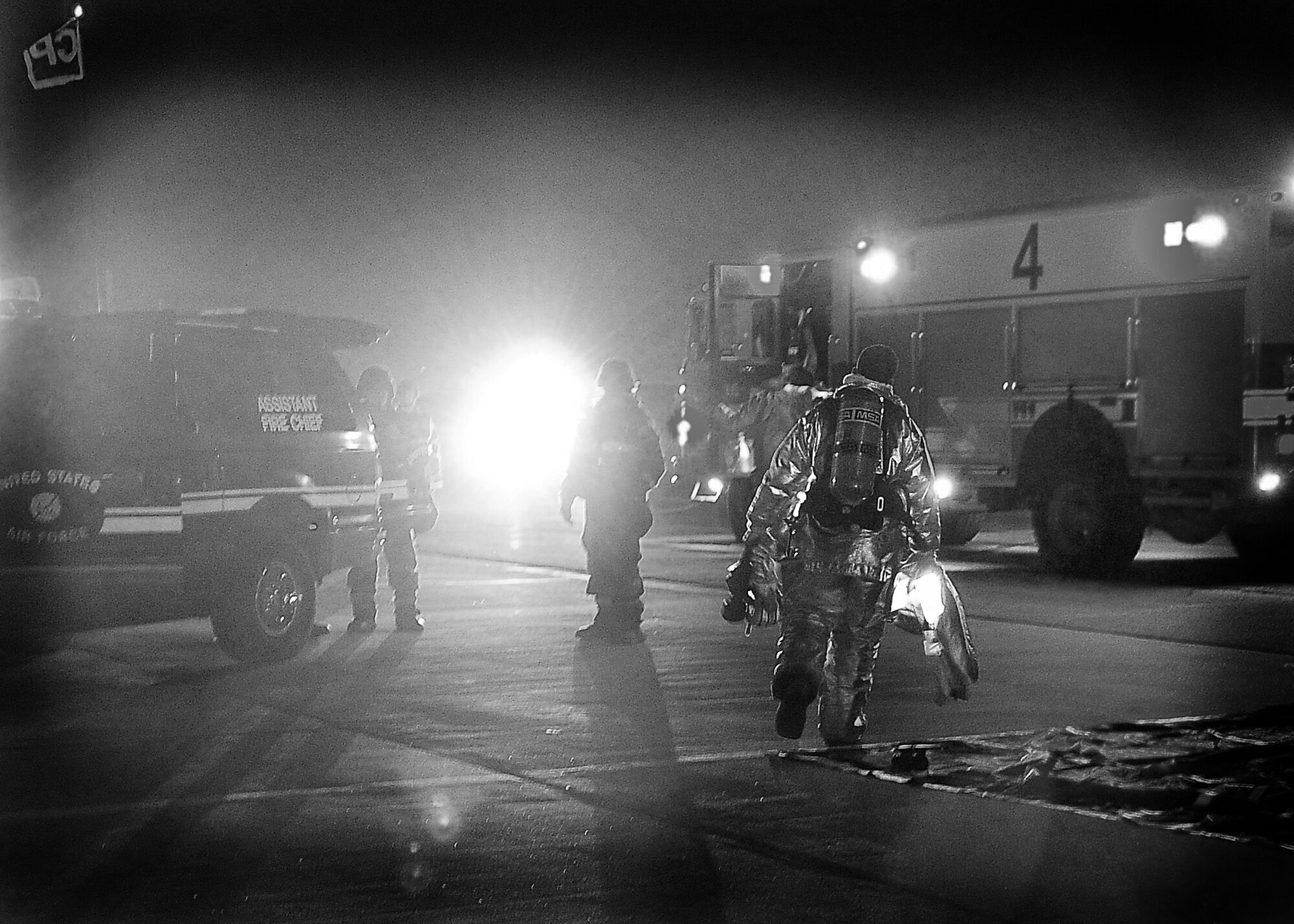 51st Fighter Wing Firefighters aid simulated casualties during Operational Readiness Exercise Beverly Midnight 11-02 at Osan Air Base, Republic of Korea March. 14. The exercise allows Airmen to demonstrate their ability to complete the mission in simulated chemical environments while executing their primary duties, practicing self aid and buddy care, conduction post-attack reconnaissance and unexploded ordnance sweeps. (U.S. Air Force Photo/Senior Airman Evelyn Chavez)