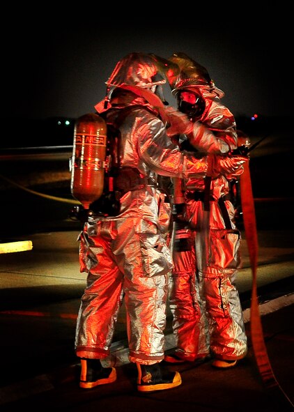 51st Fighter Wing Firefighters prepare to respond to a simulated scenario during Operational Readiness Exercise Beverly Midnight 11-02 at Osan Air Base, Republic of Korea March. 14. The exercise allows Airmen to demonstrate their ability to complete the mission in simulated chemical environments while executing their primary duties, practicing self aid and buddy care, conduction post-attack reconnaissance and unexploded ordnance sweeps. (U.S. Air Force Photo/Senior Airman Evelyn Chavez)