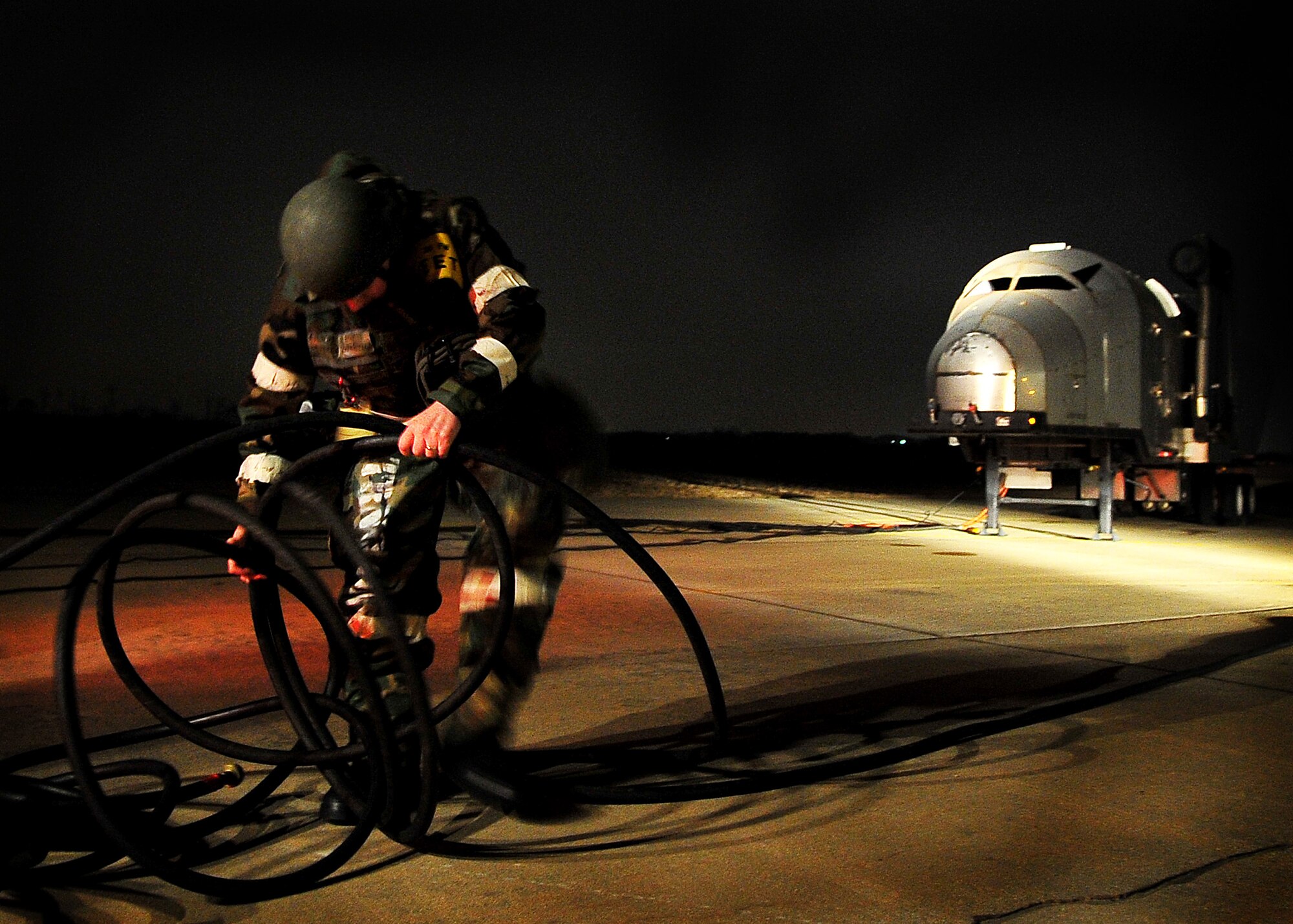 A 51st Fighter Wing Exercise Evaluation Team member prepares a simulated scenario during Operational Readiness Exercise Beverly Midnight 11-02 at Osan Air Base, Republic of Korea March 14. The exercise allows Airmen to demonstrate their ability to complete the mission in simulated chemical environments while executing their primary duties, practicing self aid and buddy care, conduction post-attack reconnaissance and unexploded ordnance sweeps. (U.S. Air Force Photo/Senior Airman Evelyn Chavez)