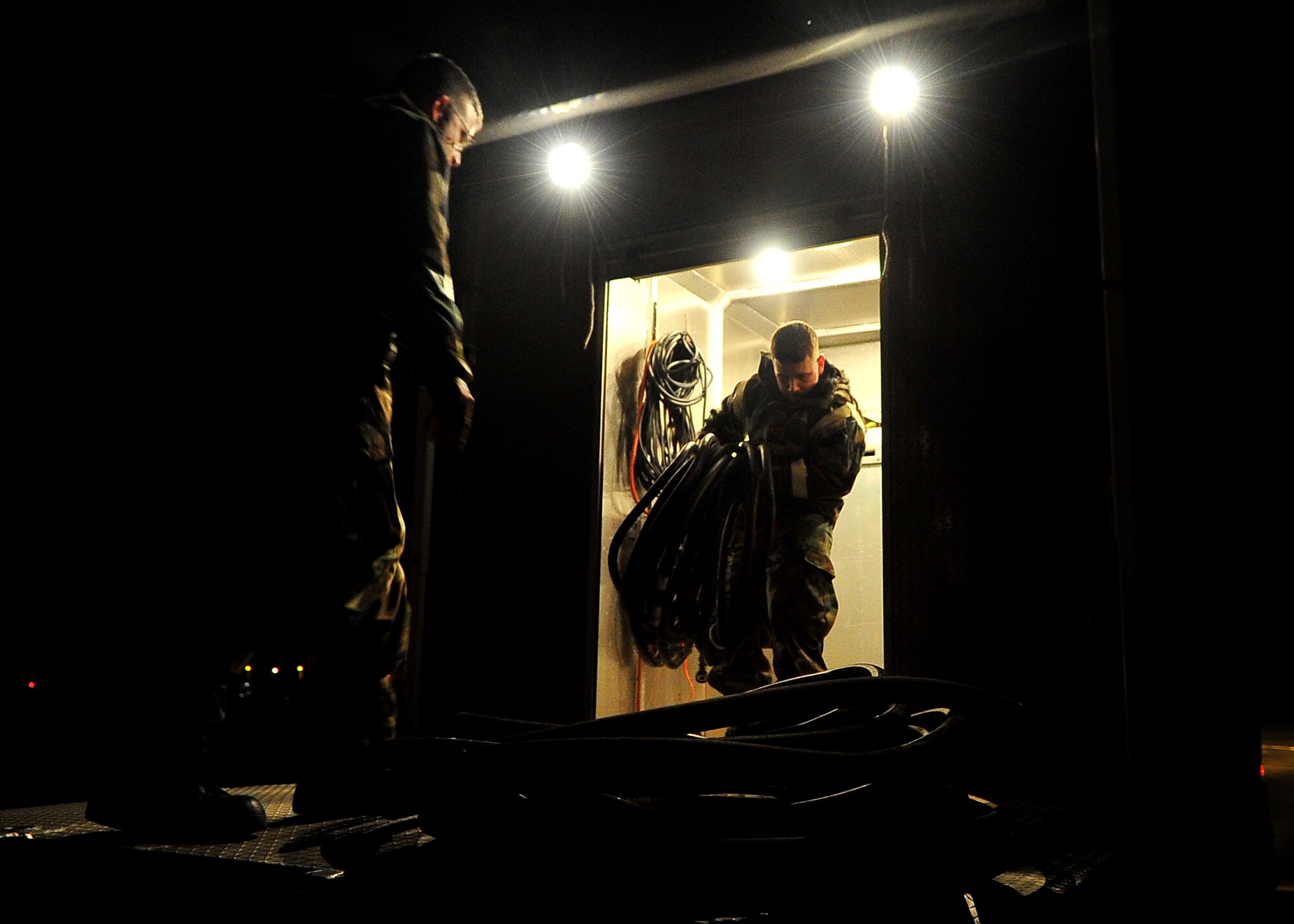 51st Fighter Wing Exercise Evaluation Team members prepare a setup for a simulated scenario during Operational Readiness Exercise Beverly Midnight 11-02 at Osan Air Base, Republic of Korea March 14. The exercise allows Airmen to demonstrate their ability to complete the mission in simulated chemical environments while executing their primary duties, practicing self aid and buddy care, conduction post-attack reconnaissance and unexploded ordnance sweeps. (U.S. Air Force Photo/Senior Airman Evelyn Chavez)