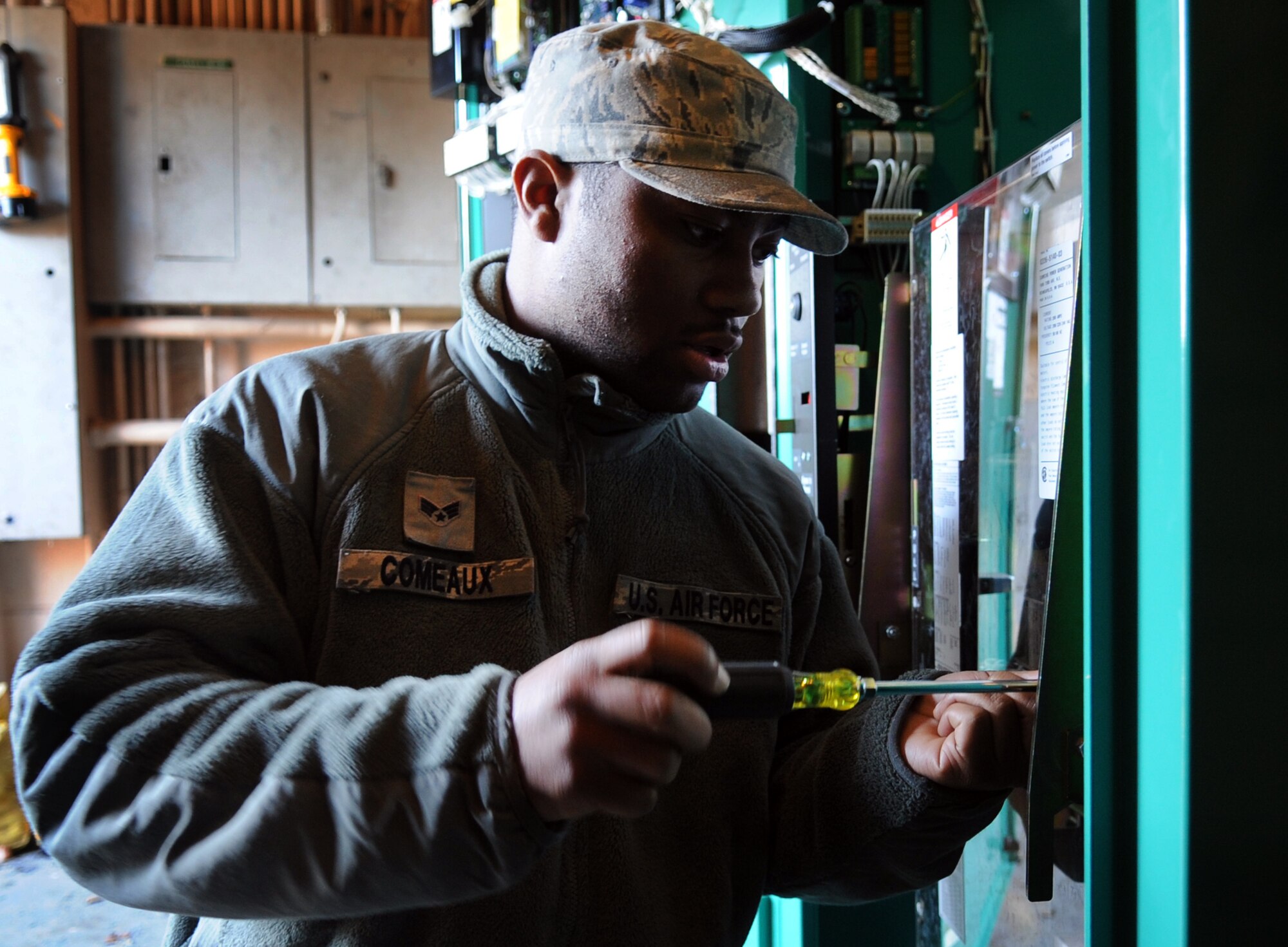 MOODY AIR FORCE BASE, Ga. -- Senior Airman Desmonn Comeaux, 23rd Civil Engineer Squadron electrical power production journeyman, prepares an automatic transfer switch to be connected with electric power March 12. The switch transfers power to a generator.(U.S. Air Force photo/Airman 1st Class Douglas Ellis)(RELEASED)
