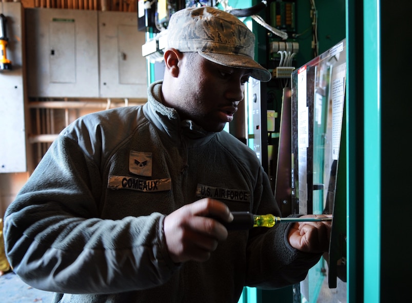 MOODY AIR FORCE BASE, Ga. -- Senior Airman Desmonn Comeaux, 23rd Civil Engineer Squadron electrical power production journeyman, prepares an automatic transfer switch to be connected with electric power March 12. The switch transfers power to a generator.(U.S. Air Force photo/Airman 1st Class Douglas Ellis)(RELEASED)
