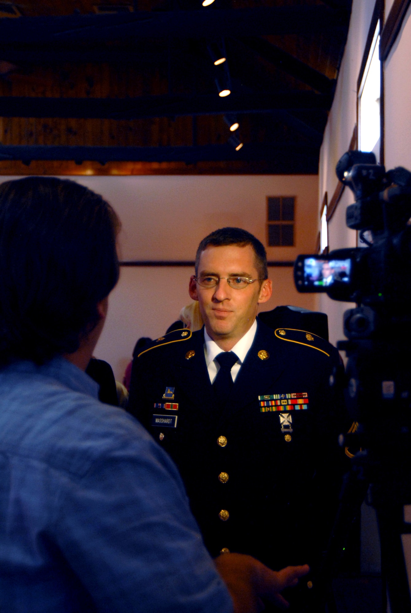 SAN ANGELO, Texas -- Army Staff Sgt. Timothy P. Masshardt, 344th Military Intelligence Battalion, is interviewed by a local TV station after receiving the Order of Merit Award March 8 at Fort Concho.  Staff Sgt. Masshardt was one of five Goodfellow nominees sent to the San Angelo Chamber of Commerce for the award. (U.S. Air Force photo/Kent Cummins)