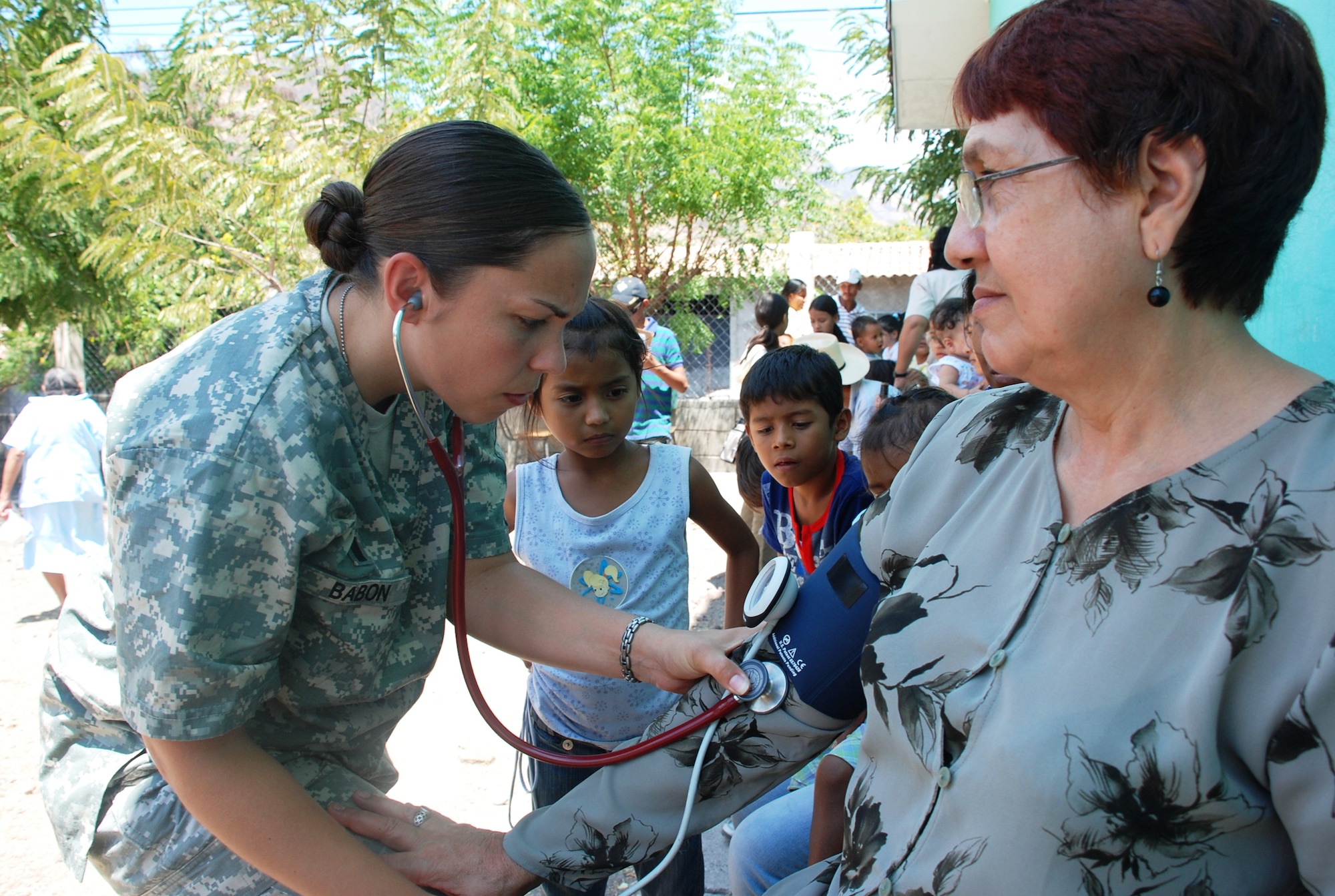 SOTO CANO AIR BASE, Honduras - 1Lt. Eilleen Babon, Joint Task Force-Bravo Medical Element nurse, checks the blood pressure of a patient in Choluteca Mar. 11.  Lieutennant Babon was part of a Medical Readiness and Training Exercise held there to assist the Honduran Ministry of Health in providing basic medical services to residents of the area.  JTF-Bravo routinely conducts training exercises throughout Central Americal to ensure regional stability as well as to our ability to respond to natural disasters, provide humanitarian assistance, and protect the vital interests of the United States. (U.S. Air Force photo/Capt. John T. Stamm)