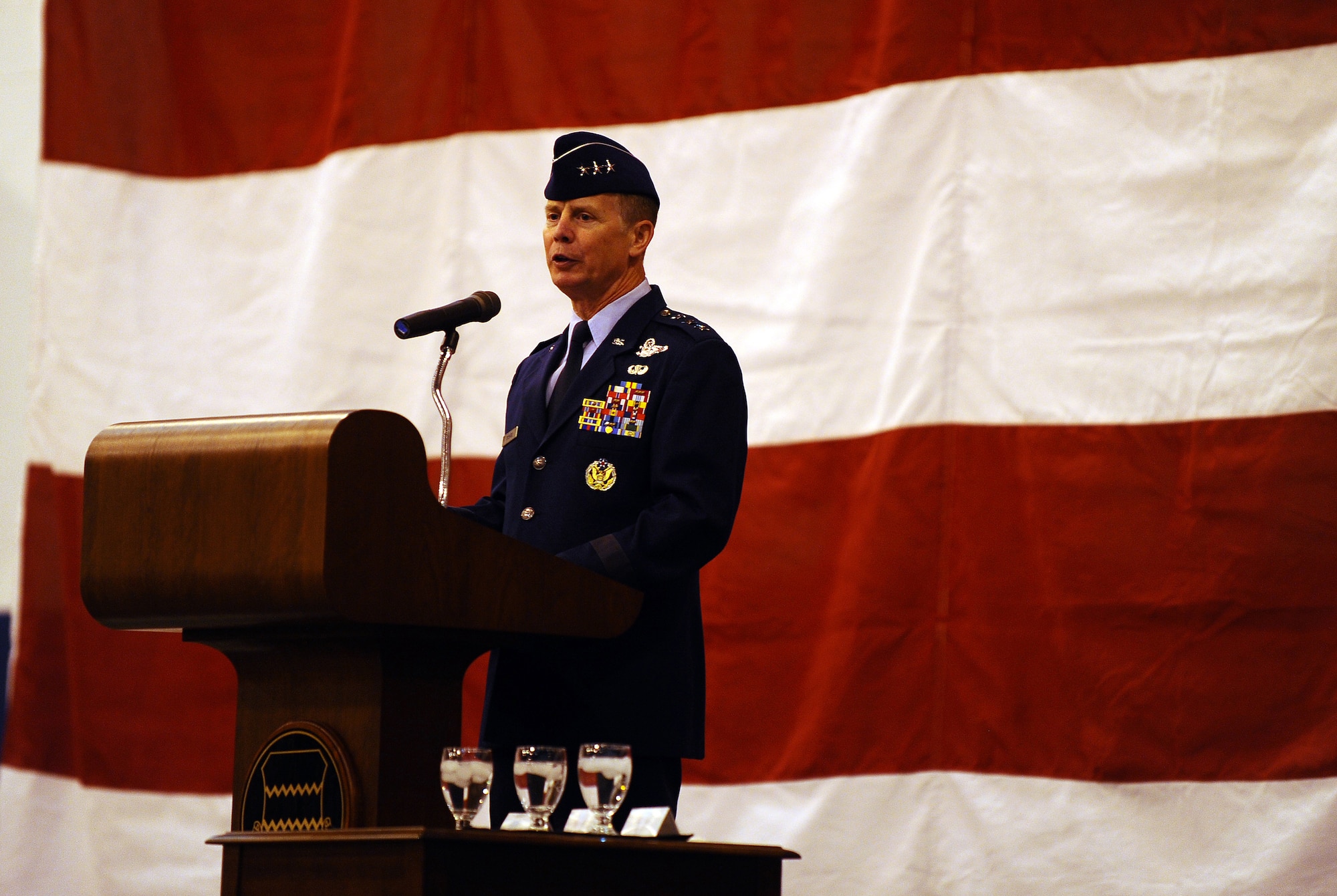 OFFUTT AIR FORCE BASE, Neb. - Lt. Gen. Glenn Spears, 12th Air Force commander, address the audience at a change of command ceremony March 9 at the Bennie Davis Maintenance Facility. General Spears presented outgoing 55th Wing Commander Brig. Gen. John N.T. Shanahan with the Legion of Merit during the ceremony. U.S. Air Force photo by Josh Plueger (released) 