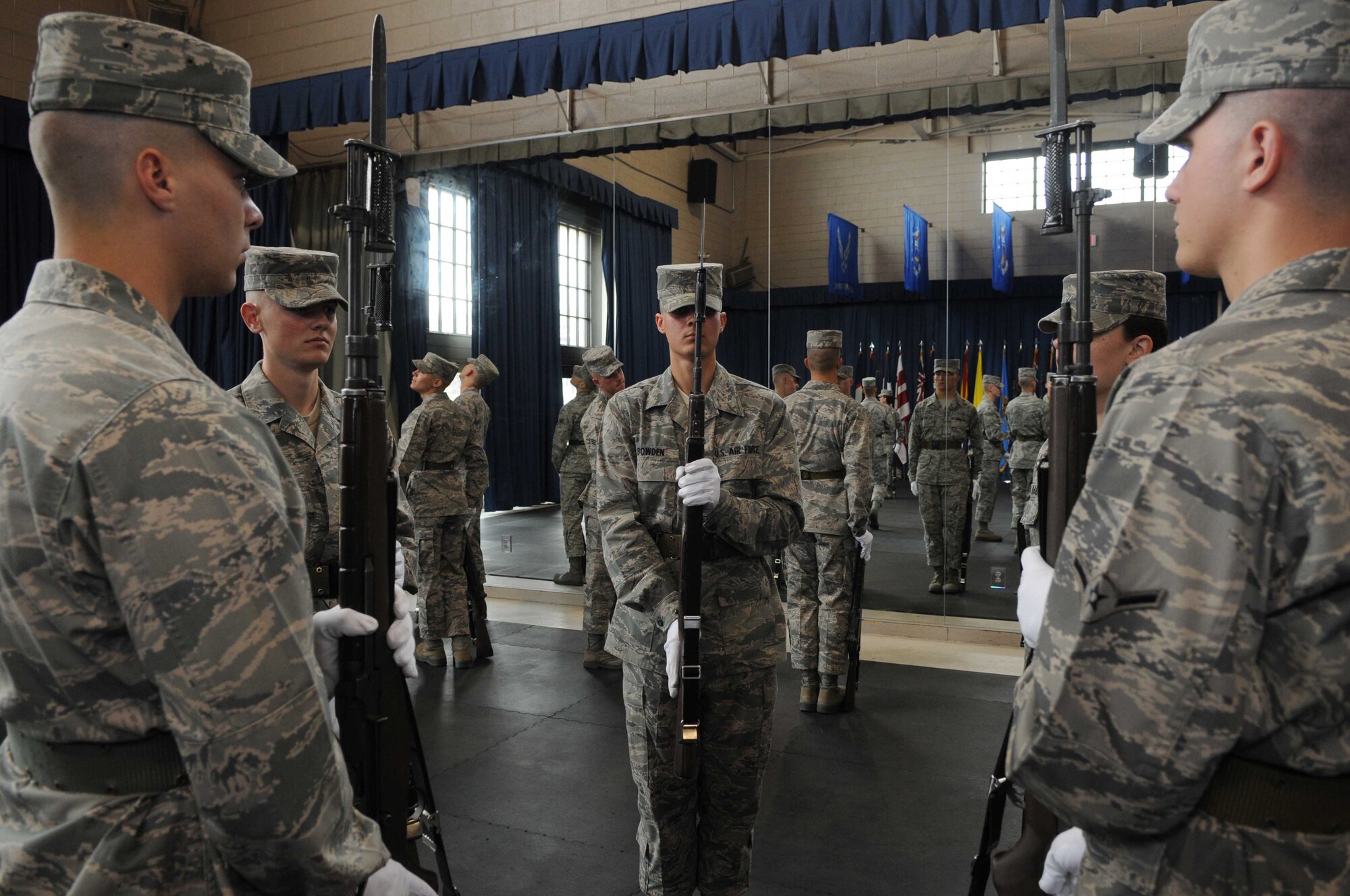 Trainees in The U.S. Air Force Honor Guard technical training school practice drill movements March 11 at Joint Base Anacostia-Bolling, Washington, D.C. The USAF Honor Guard trainees have completed half of their eight-week training course. They are required to complete the course before they are qualified to participate in the Honor Guard’s mission at Arlington National Cemetery. (U.S. Air Force photo by Senior Airman Christopher Ruano)