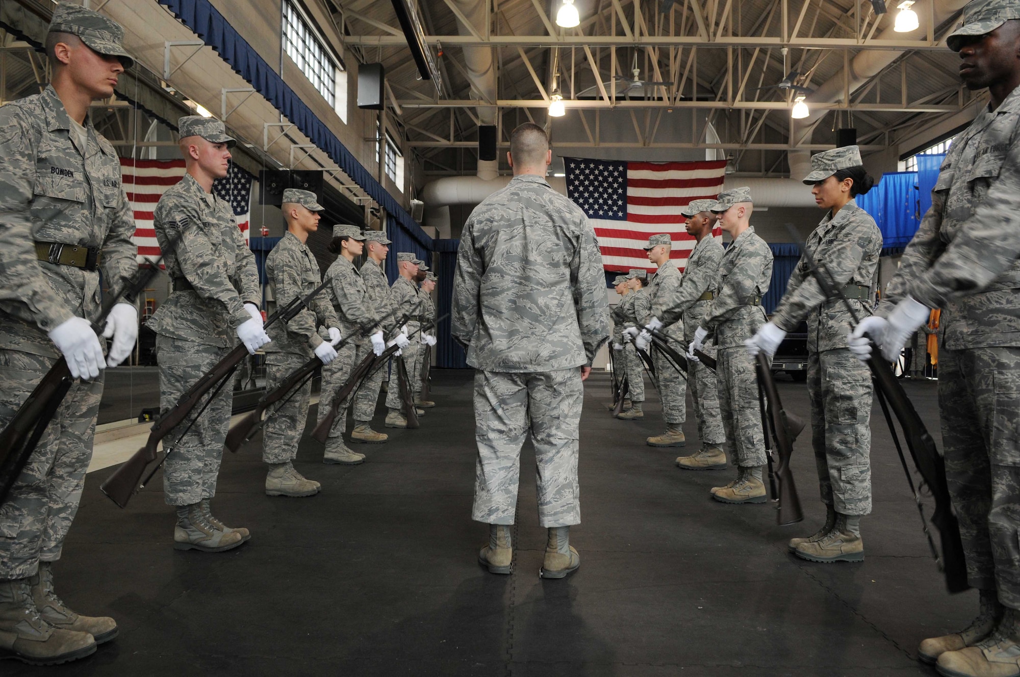 Senior Airman Leonard Brower, training course supervisor with The U.S. Air Force Honor Guard, inspects the USAF Honor Guard trainee’s drill movements March 11 at Joint Base Anacostia-Bolling, Washington, D.C. The USAF Honor Guard trainees are inspected regularly and comply with weekly assessments of there performance. (U.S. Air Force photo by Senior Airman Christopher Ruano)