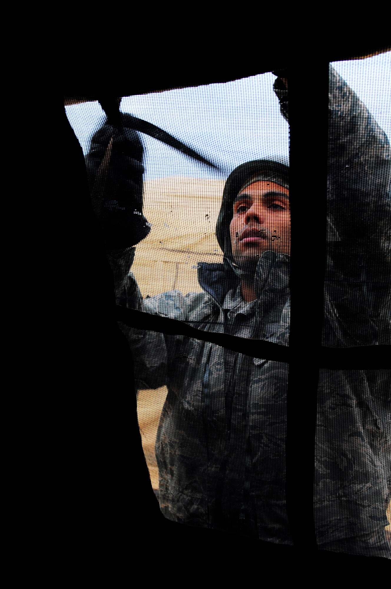 U.S. Air Force Airman 1st Class George Murray, 100th Civil Engineer Squadron, helps erect a tent during the practical application exercise portion of Silver Flag, Ramstein Air Base, Germany, March 11, 2011. Silver Flag is a weeklong, training program that Airmen from all over the world participate in. Silver Flag combines classroom and practical application exercises to prepare airmen for deployment. (U.S. Air Force Photo by Airman 1st Class Brea Miller)
