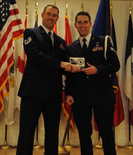 Senior Airman Christopher M. Young, 9th Air Support Operations Squadron, Fort Hood, Texas, is awarded the Academic Excellence Award at an Airmen Leadership School graduation here Feb. 15 by Tech Sgt. Chad R. Kirkland, AFSA chapter 1056 president. The Academic Excellence Award is sponsored by AFSA chapter 1056; the award is given to the student who demonstrates academic excellence in all summative, objective and performance evaluations.