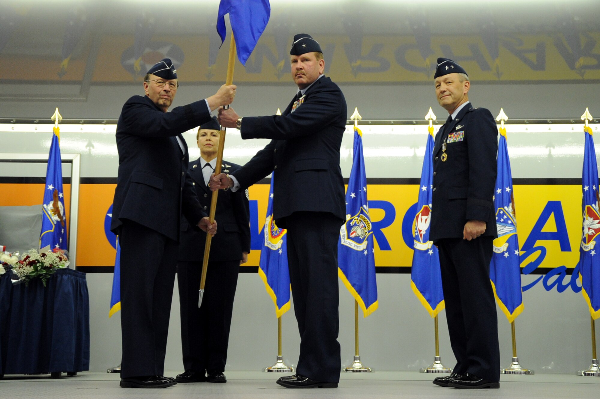 MARCH AIR RESERVE BASE, Calif. U.S. Air Force Brig. Gen. Mark Kyle (center) accepts the flag from Lt. Gen. Charles Stenner during a change of command ceremony on March 12, 2011.  General Kyle assumed command of 4th Air Force from Maj. Gen. Eric Crabtree (right).  General Crabtree is leaving March ARB, Calif., for a position at the Pentagon.  (U.S. Air Force photo by Tech Sgt. Joe Zuccaro) (released)