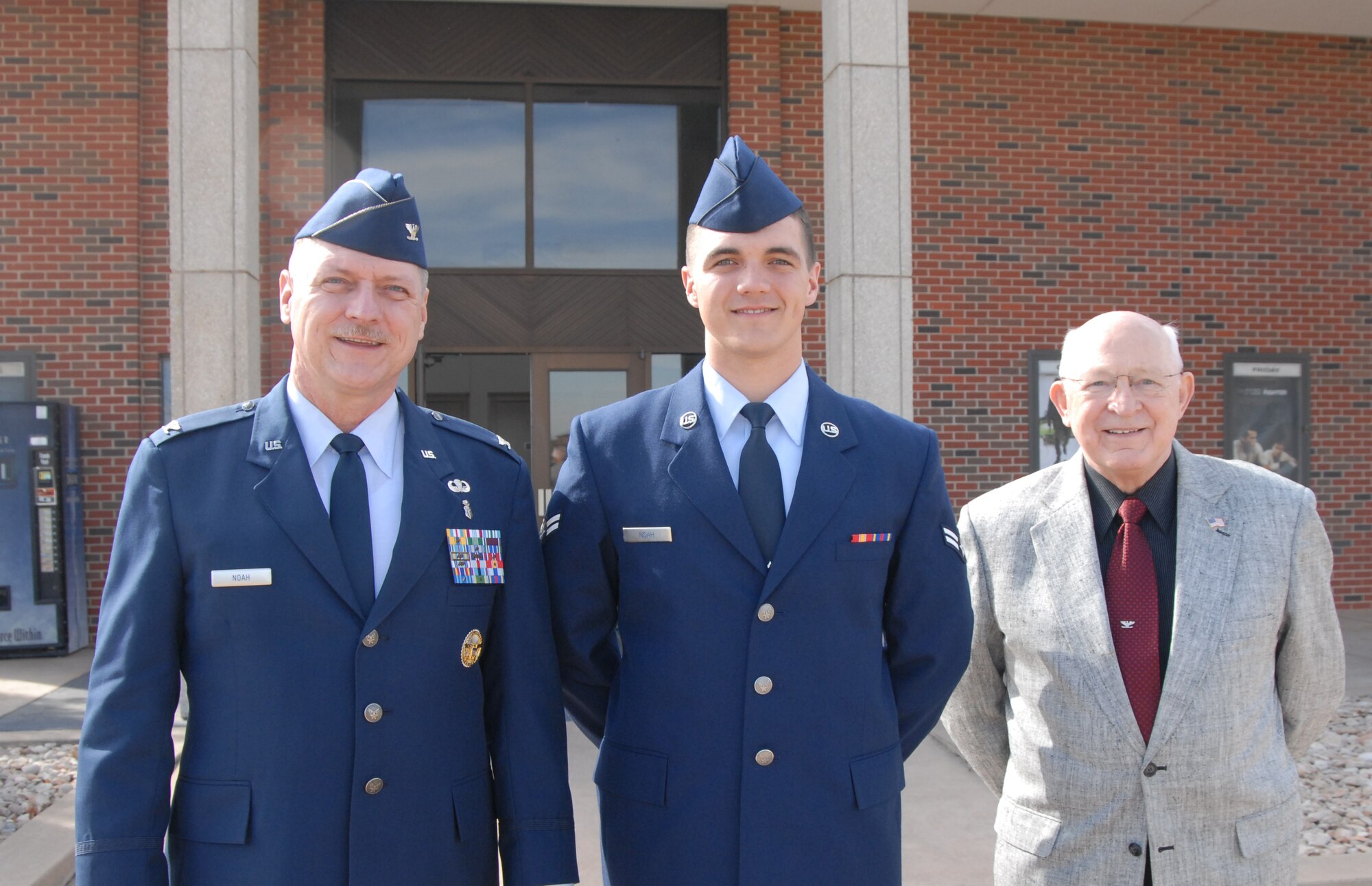 Airman Donald Noah, a former 315th Training Squadron student, his father Col. Donald Noah and his grandfather Ret. Col. Donald Owen Noah, pose after the Airman's graduation ceremony at the Base Theatre, Feb. 14. (U.S. Air Force photo/Senior Airman Anne Gathua)
