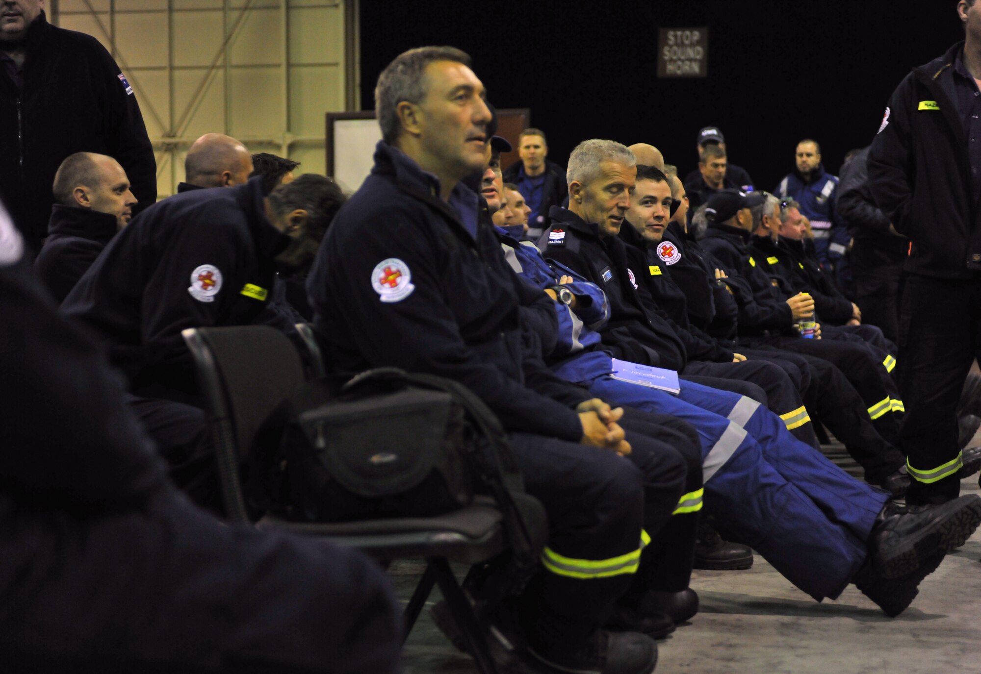 YOKOTA AIR BASE, Japan --  Members of the Queenland Urban Search and Rescue Taskforce wait to process through the base receiving personnel  line here March 14, to assist with Japan's earthquake and tsunami recovery effort. (U.S. Air Force photo/Master Sgt. Kimberly Spinner) 