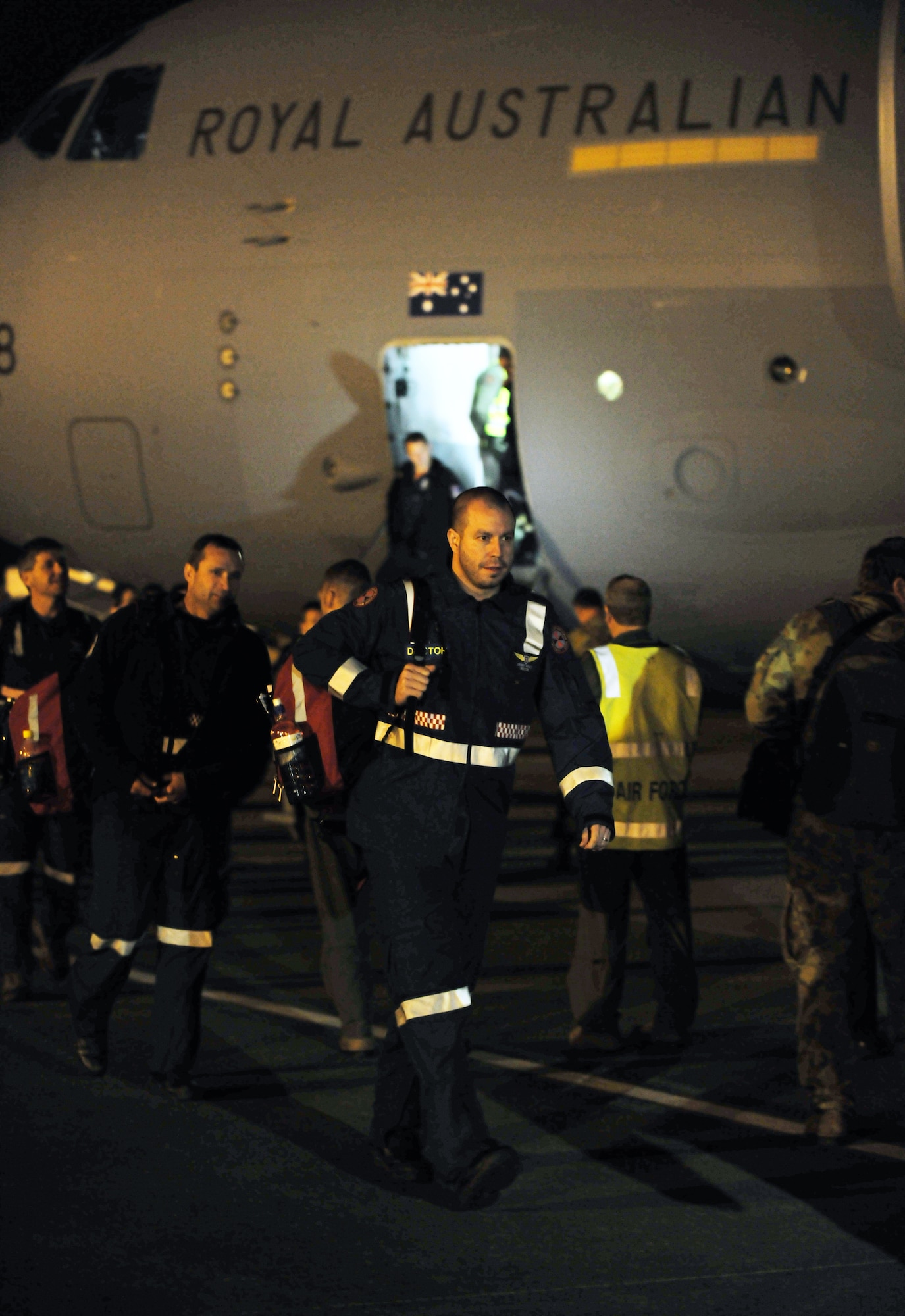 YOKOTA AIR BASE, Japan --  Members of the Queenland Urban Search and Rescue Taskforce arrive  here March 14 to assist with Japan's earthquake and tsunami recovery effort. (U.S. Air Force photo/Master Sgt. Kimberly Spinner) 