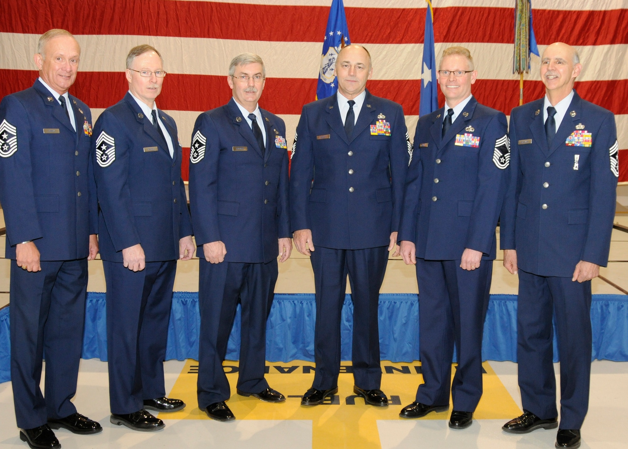 The six chief master sergeants who have served as the command chief master sergeant or senior enlisted advisor of the 127th Wing gathered together March 12, 2011, to mark the occasion of the installation of the wing’s current command chief, Chief Master Sgt. Robert Dobson. At the ceremony were CMSgt. (ret.) William Livesay; CMSgt. Michael Dalton, who is currently the command chief for the Michigan Air National Guard; CMSgt. (ret.) Keith Edwards, the wing’s outgoing command chief who retired in the same ceremony; CMSgt. James Hewett; CMSgt. Dobson; and CMSgt. (ret.) Stephen Krajewski. The ceremony at Selfridge Air National Guard Base, Mich., marked the first time all of the wing’s former senior enlisted member had been together. (U.S. Air Force photo by TSgt. David Kujawa) (RELEASED)