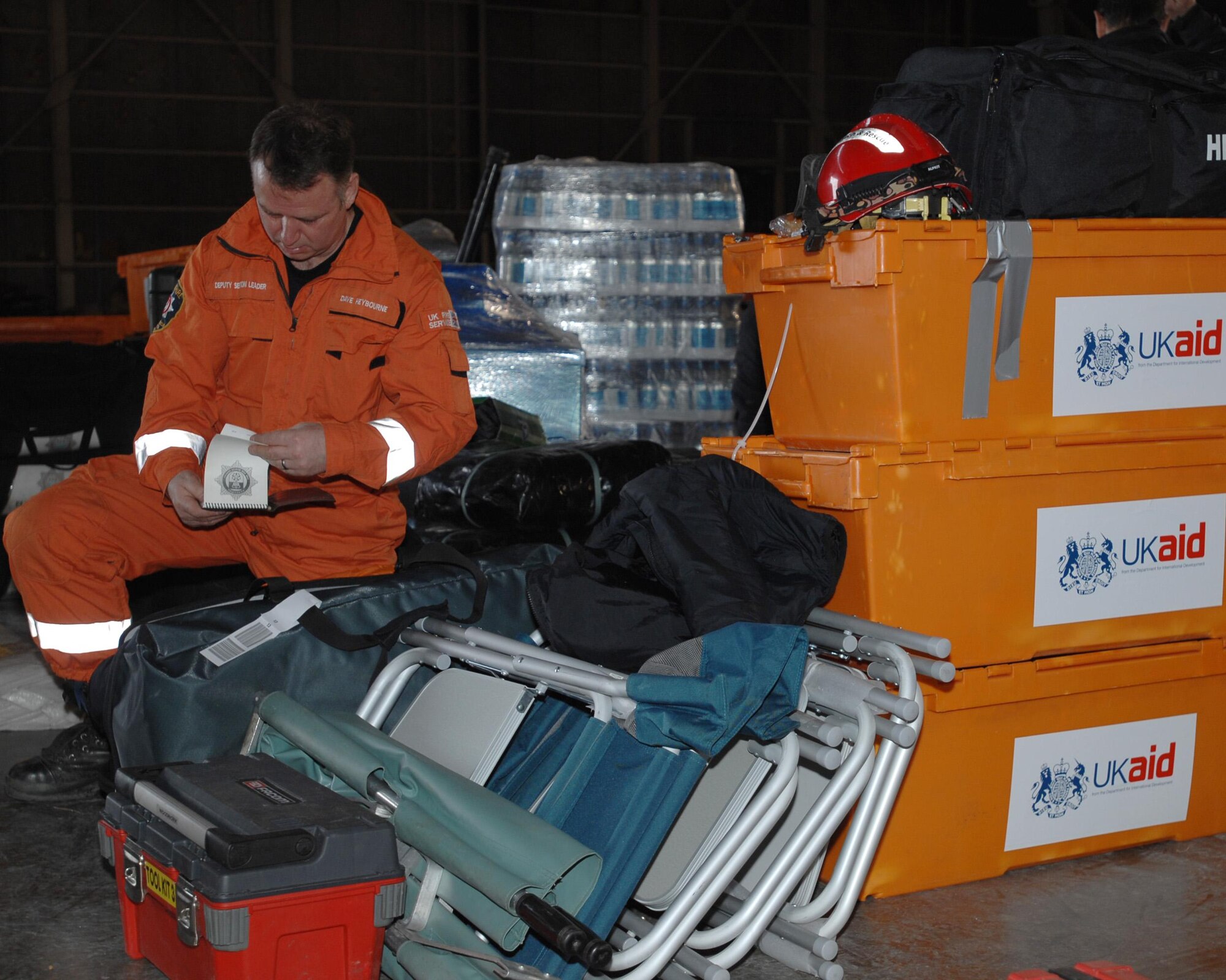 United Kingdom International Search and Rescue team member Dave Heybourne preps his gear to support relief operations at Misawa Air Base, Japan, on March 14, 2011. Mr. Heybourne's team arrived in Misawa following an 8.9-magnitude earthquake that triggered a tsunami off Japan's eastern coast. The team traveled to Ofurnatu, Japan, to assist with search and rescue operations. (U.S. Navy Photo/Chief Petty Officer Daniel Sanford)