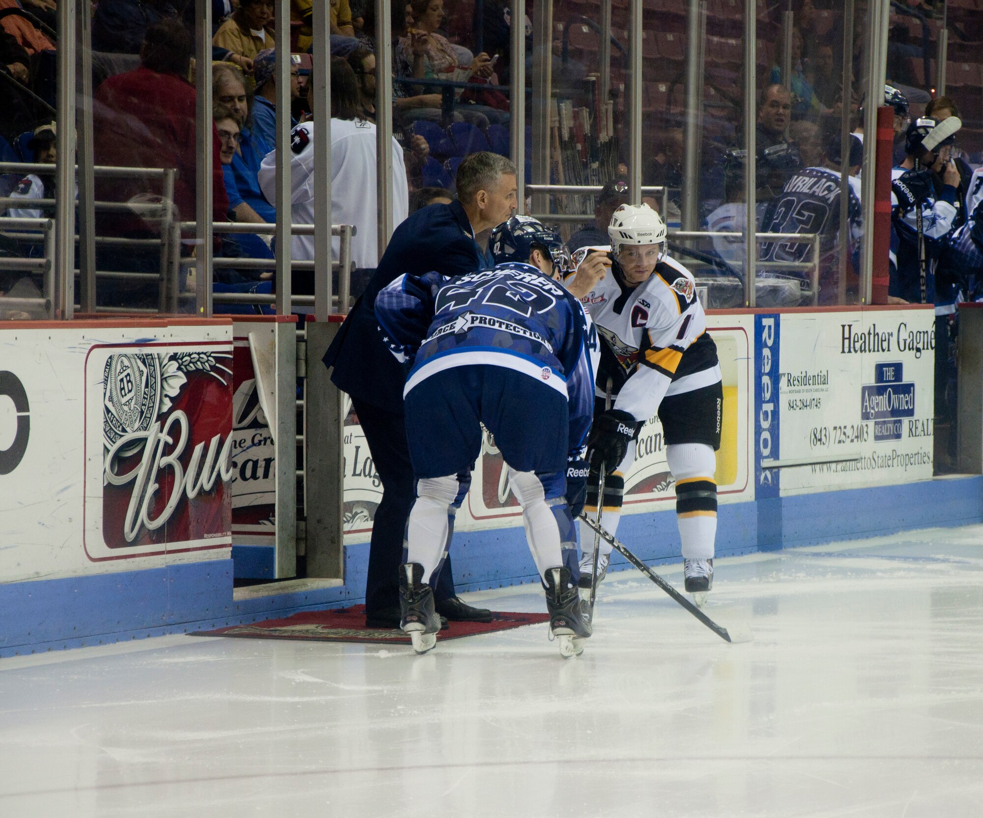 315th Airlift Wing Commander Colonel Steven Chapman drops the opening puck at Military Appreciation Night before the SC Stingrays game Sunday at North Charleston Coliseum. The Singrays welcomed all uniformed service members in Charleston for the game agains the Cincinnati Cyclones. (U.S. Air Force Photo/SrA Bobby Pilch)