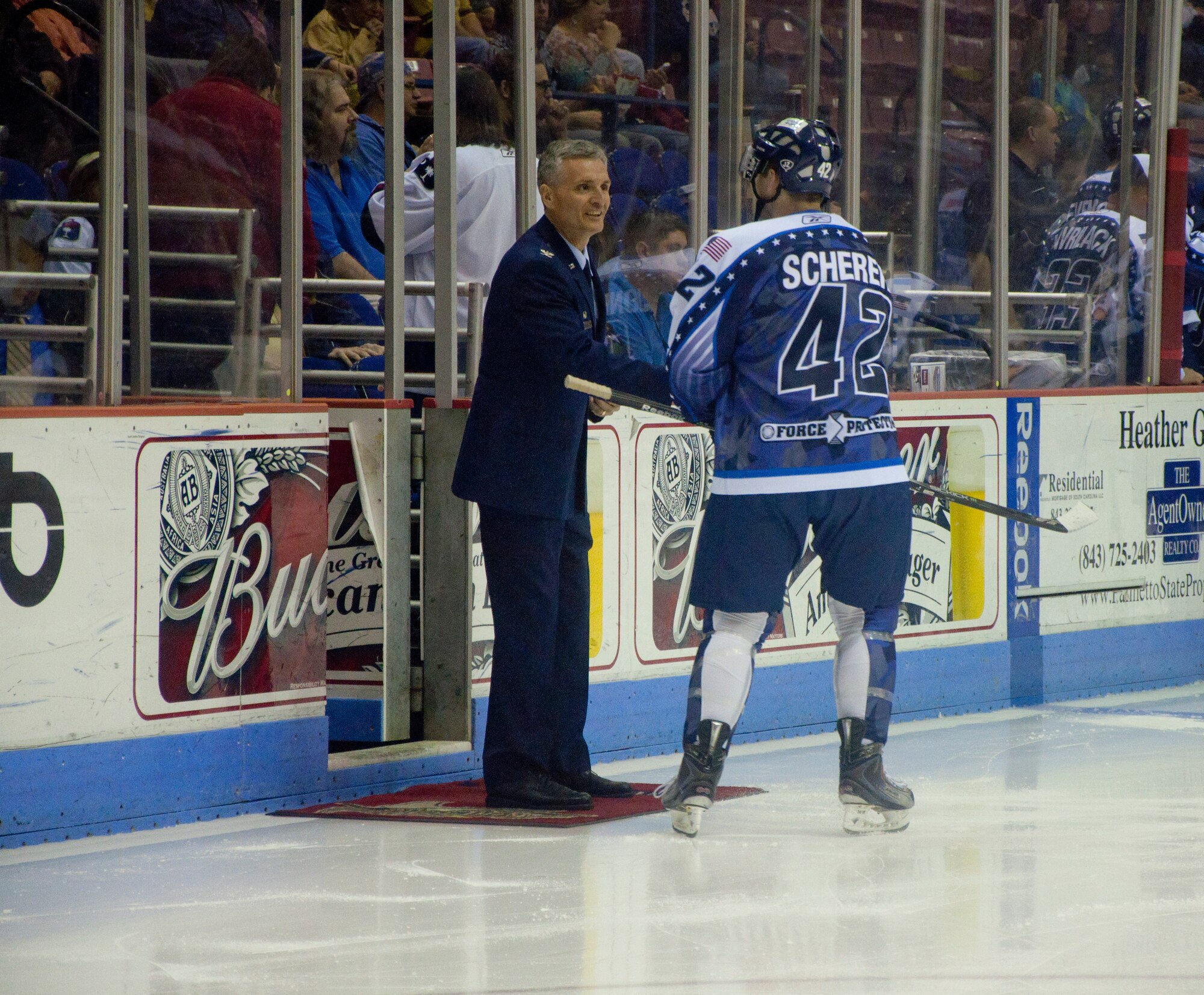315th Airlift Wing Commander meets SC Stingray Captain Matt Scherer during the military appreciation night Sunday at the North Charleston Coliseum. The more than 150 wing members in attendace saw an exciting game which ended in a shootout. (U.S. Air Force Photo/SrA Bobby Pilch)