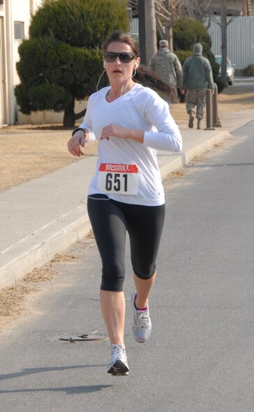 KUNSAN AIR BASE, Republic of Korea -- Ser Gabler, wife of Capt. David Gabler, 35th Fighter Squadron, completes the Kunsan half-marathon March 11. Mrs. Gabler was the female aged 40 and under first-place winner with a time of 1:47:11. (U.S. Air Force/Staff Sgt. Amanda Savannah)