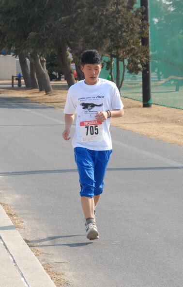 KUNSAN AIR BASE, Republic of Korea -- Staff Sgt. Kim Yeon-Su, ROK Air Force 38th Fighter Group, completes the Kunsan half-marathon March 11. Sergeant Kim was the male aged 40 and under first-place winner with a time of 1:35:12. (U.S. Air Force/Staff Sgt. Amanda Savannah)