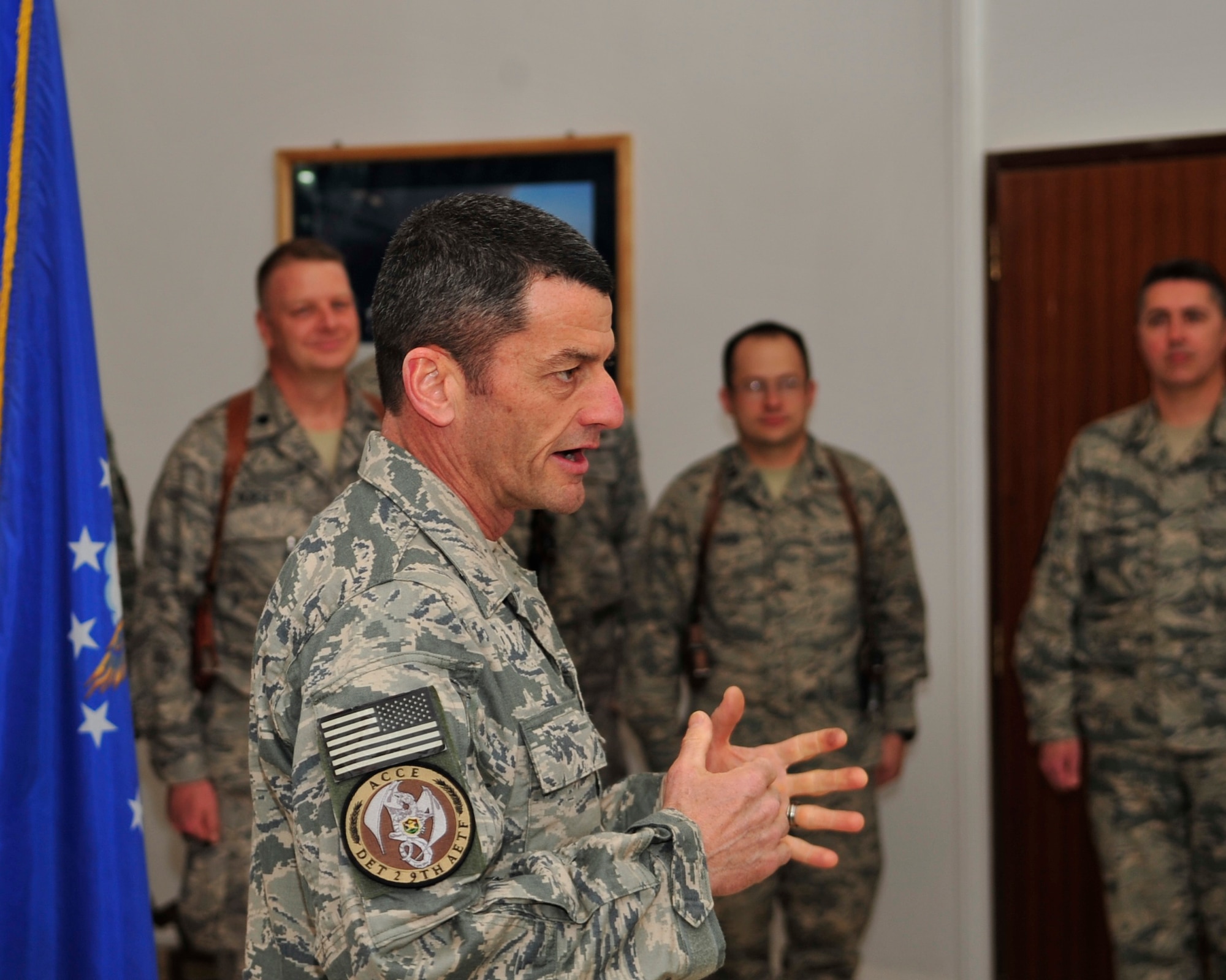 Brig. Gen. Russ Handy, 9th Air and Space Expeditionary Task Force-Iraq commander, talks about the importance of field grade officer rank during Capt. Brent Bak’s and Capt. Ryan McLain’s, 9th AETF-I, promotion ceremony to major Camp Victory, Baghdad, Feb. 28, 2011.  (Air Force photo by Senior Master Sgt. Larry Schneck/Released)