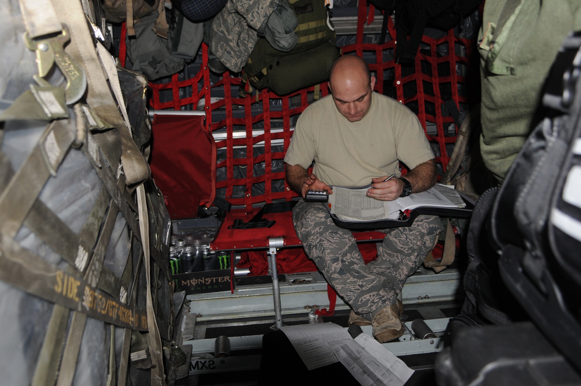 KADENA AIR BASE, Japan -- Staff Sgt. Jason Lemke, a 1st Special Operations Squadron loadmaster, finalizes load plans on a fully-loaded MC-130H Combat Talon II here March 14. The aircraft is delivering additional equipment and support forces for the 353rd Special Operations Group forces deployed supporting humanitarian relief efforts at Yokota Air Base. (U.S. Air Force photo by Tech. Sgt. Aaron Cram)