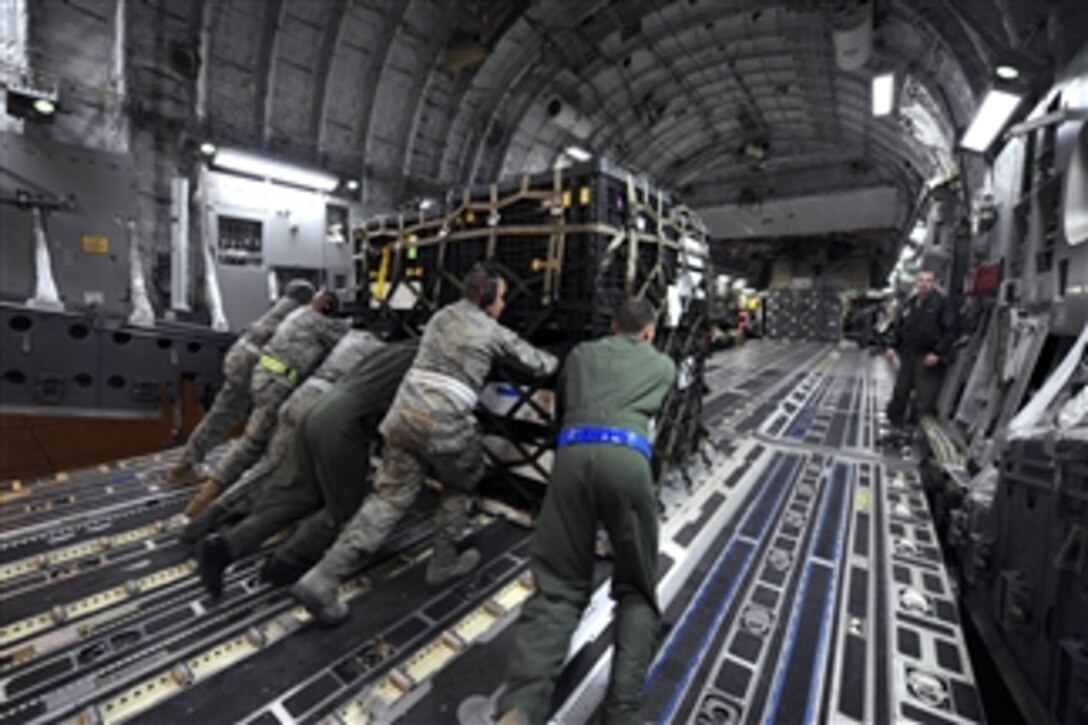 U.S. Air Force airmen load a pallet onto a U.S. Air Force C-17A Globemaster III at March Air Reserve Base, Calif., on March 12, 2011.  The supplies are en route to Japan for earthquake relief efforts.  