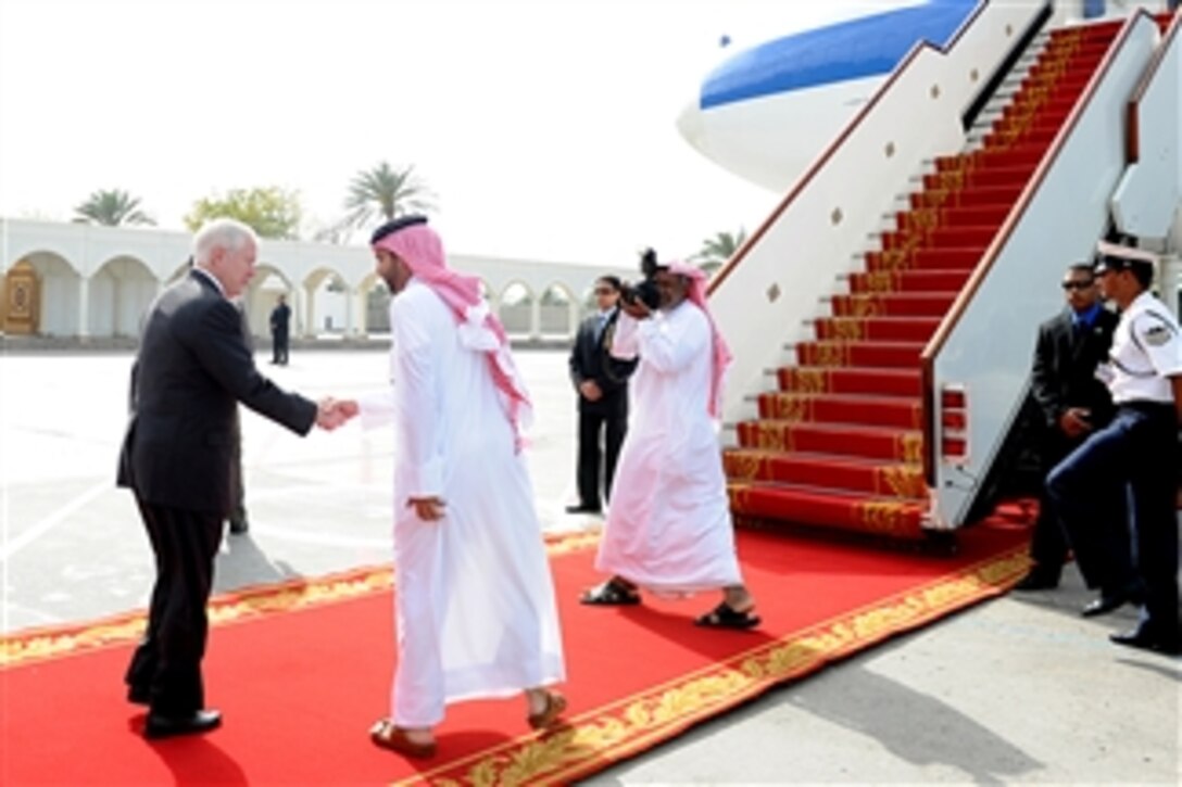 Secretary of Defense Robert M. Gates prepares to board his plane in Bahrain on March 12, 2003.  