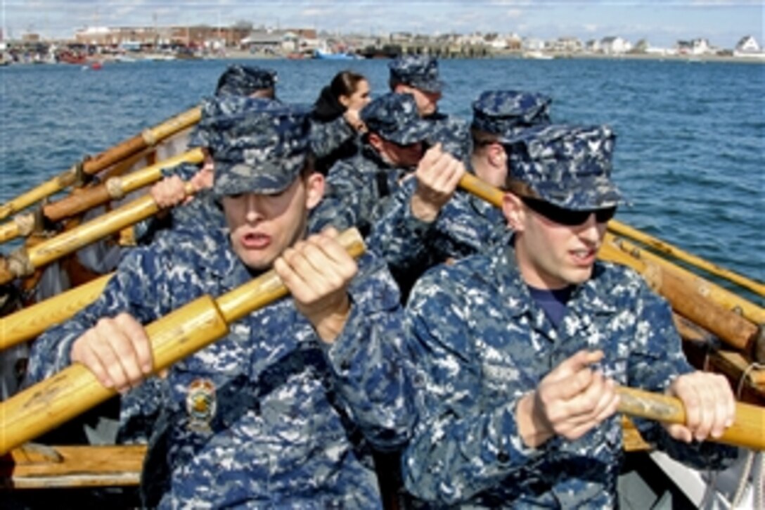 The gig crew, comprised of U.S. Navy sailors assigned to USS Constitution, pulls hard as they struggle to the finish line during the 32nd annual Snow Row in Hull, Mass., March 12, 2011. The Snow Row is a 3.75-mile triangular course that gives participants the opportunity to display their boat and seamanship skills to spectators.