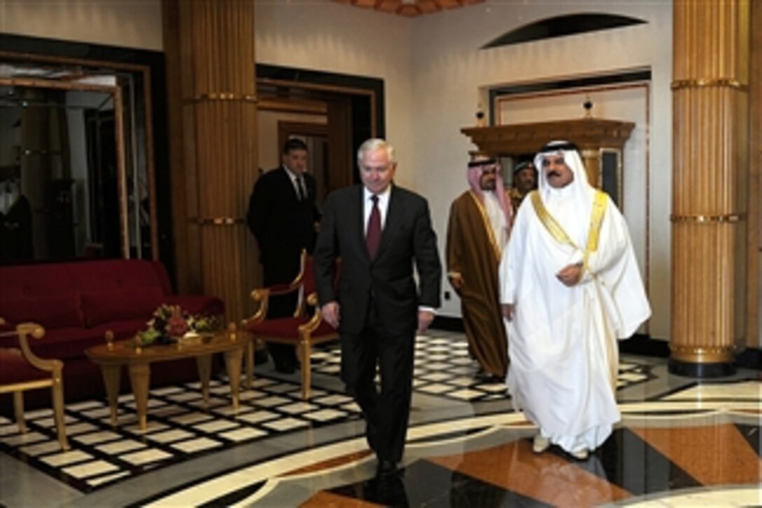 Secretary of Defense Robert M. Gates walks with the King of Bahrain Hamad bin ISA al-Khalifa after their discussions at Safriyah Palace in Bahrain on March 12, 2003.  