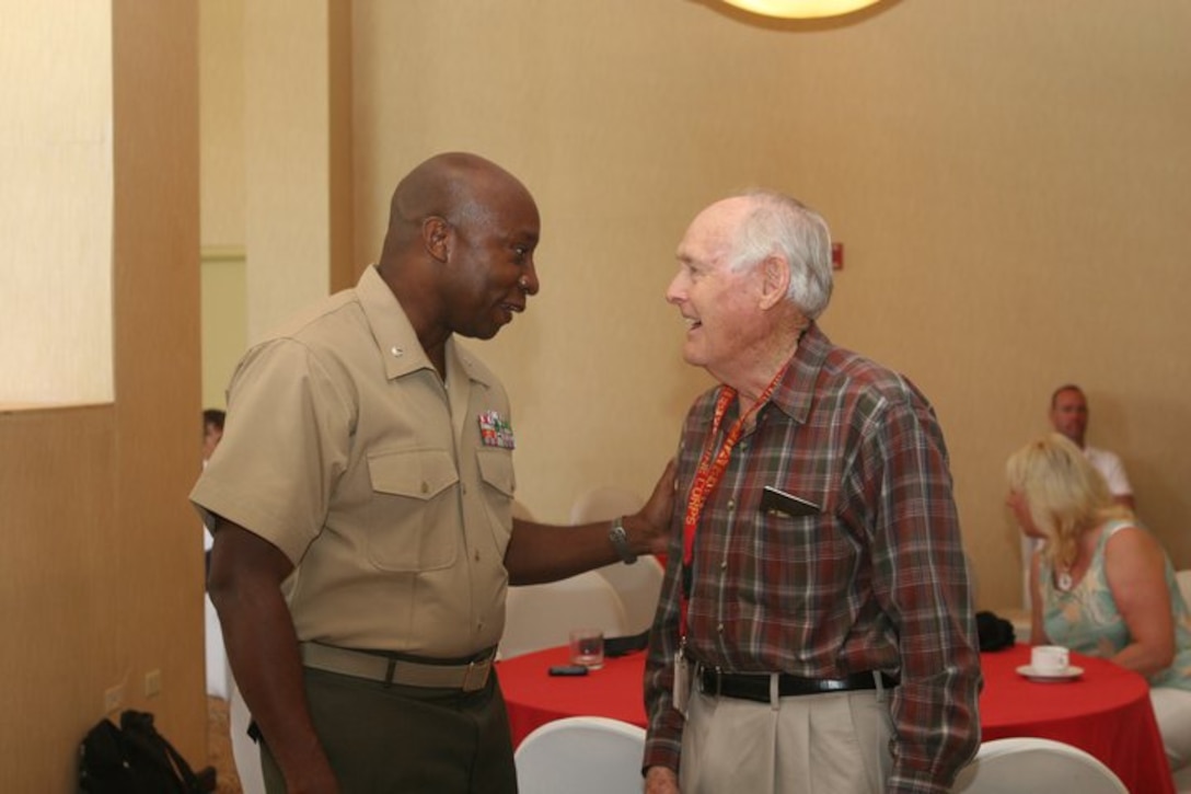 LtCol Haynessly Blake speaks with a battle of Iwo Jima Veteran during the 66th Anniversary Battle of Iwo Jima, Reunion of Honor Tour, in the Outrigger Hotel, Mar15.