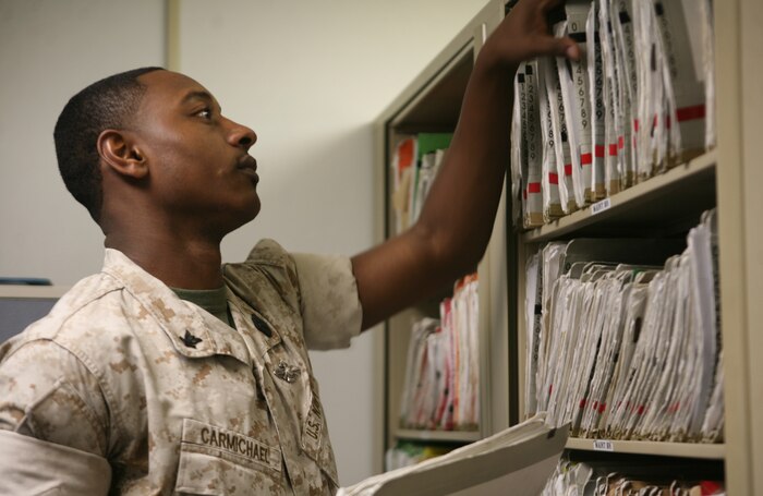 Petty Officer 3rd Class Carlos Carmichael, a hospital corpsman with Combat Logistics Regiment 27, 2nd Marine Logistics Group, files a Marine’s medical record at the 2nd MLG group aid station aboard Camp Lejeune, N.C., March 15, 2009.  Carmichael has been impressing his peers and superiors with his work ethic since his arrival to Camp Lejeune in 2008 and is departing this month for Marine Corps Air Station Yuma, Ariz. (U.S. Marine Corps photo by Cpl. Melissa A. Latty)