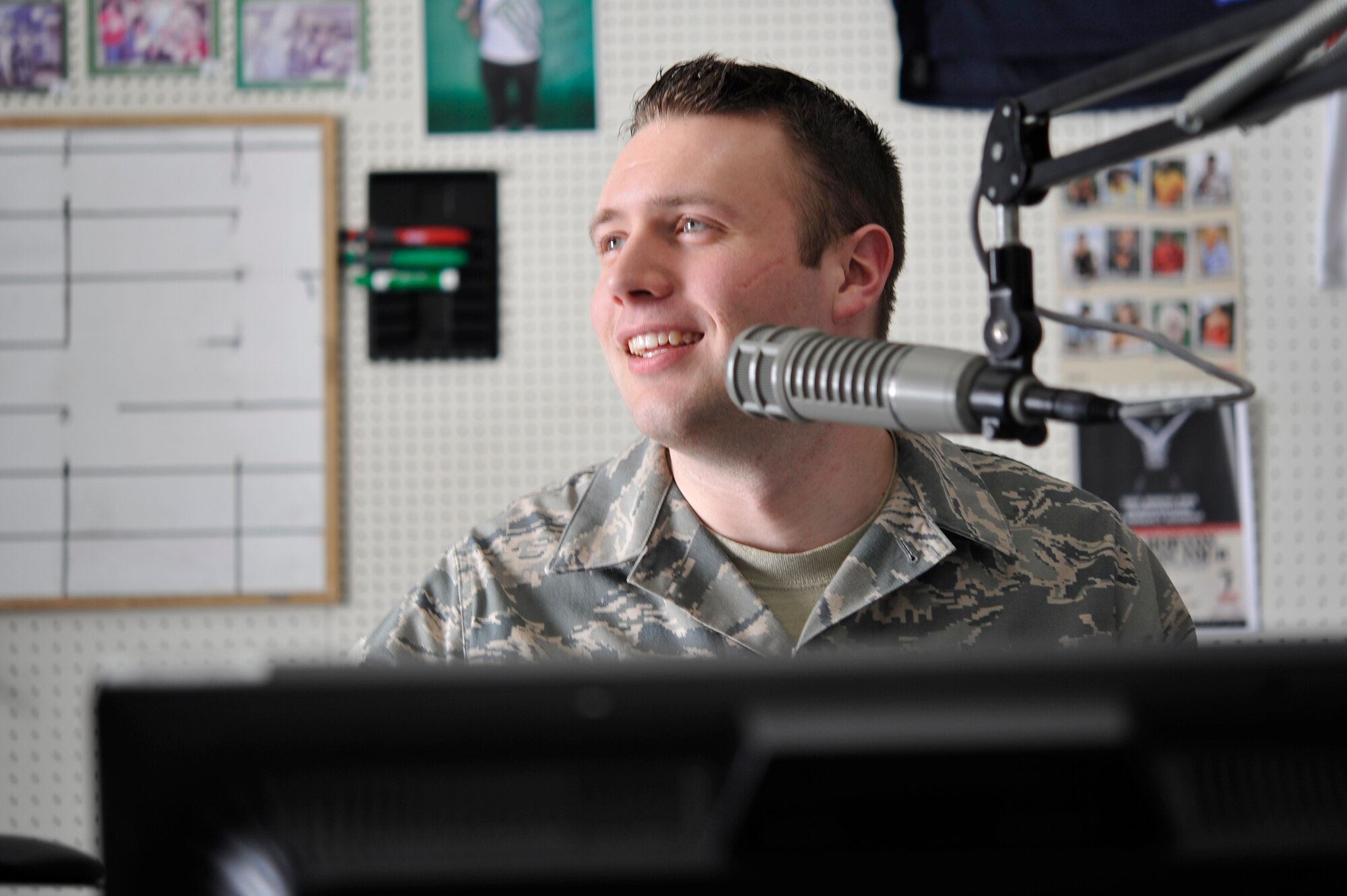MISAWA AIR BASE, Japan -- Airman First Class Jimmy “The Airman” Moreland, Detachment 12, American Forces Network broadcaster, prepares to go on the air for his morning show.   Broadcasters at AFN Misawa have been keeping listeners informed and entertained with up-to-date command information via radio, television and Facebook updates.  (U.S. Air Force Staff Sgt.  Xavyer Ortiz\Released)