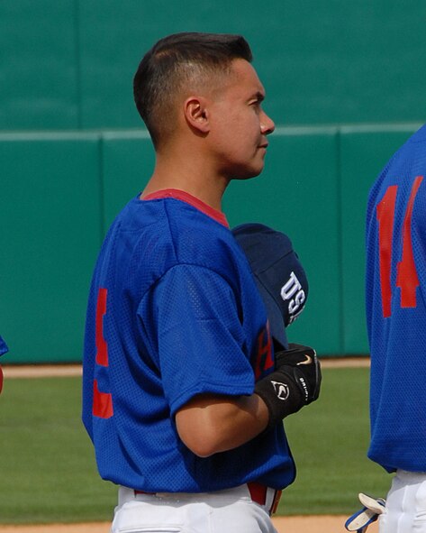 Master Sgt. Randy Wright, an Arizona Air Guardsman, shows his patriotism during the National Anthem at the Heroes vs. Legends baseball game March 12 at Kino Veterans Memorial Stadium. Wright and other local service members played an exhibition game against former Major League greats to benefit several local charities. The Heroes beat the Legends 11-2.  (US Air Force photo/Master Sgt. David Neve)

