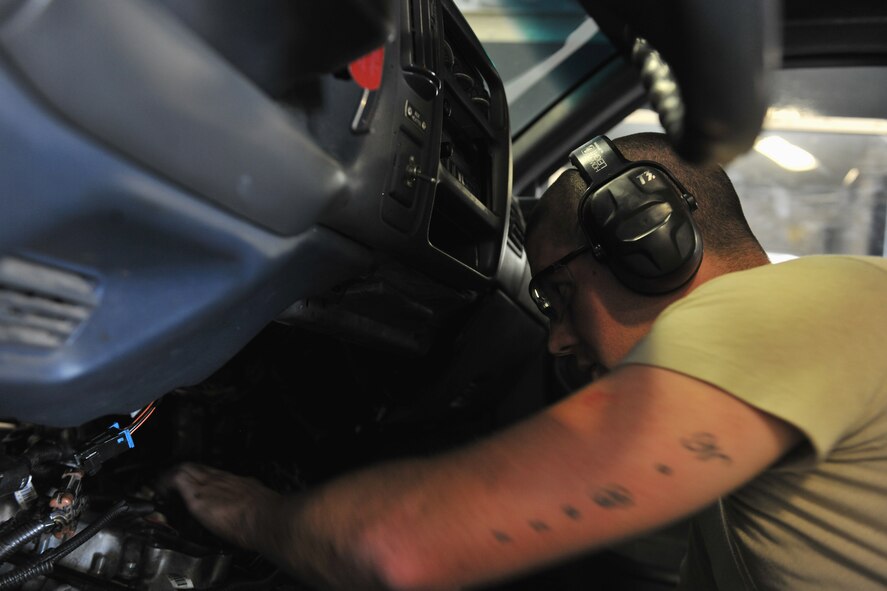 MOODY AIR FORCE BASE, Ga.-- Airman 1st Class Jacob Couch, 23rd Logistics Readiness Squadron vehicle maintenance apprentice, does a final check to ensure a fuel injection pump was installed properly March 15. Due to the compact engine and difficulty of getting into spaces it took Airman Couch a day in a half to finish. (U.S. Air Force photo/Airman 1st Class Joshua Green)(RELEASED)
