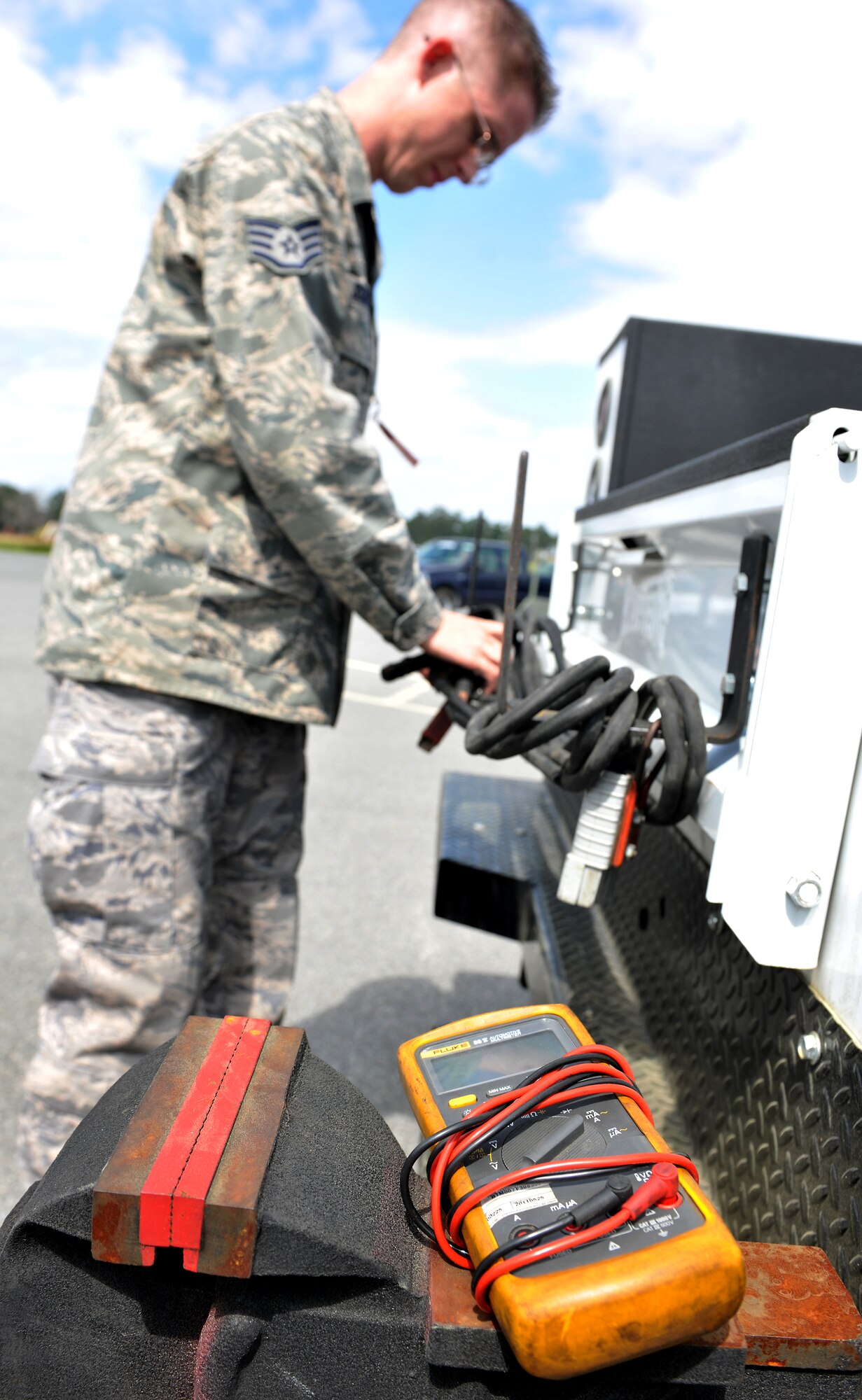 MOODY AIR FORCE BASE, Ga.-- Staff Sgt. Ryan Schmitz, 23rd Logistics Readiness Squadron vehicle maintenance customer services Non-Commissioned officer in charge, wraps up a charge cable after providing maintenance on a semi-truck March 15. Mobile operations create an easy way for vehicle maintenance members to manage work in the field and at the shop versus bringing vehicles in for every little problem. (U.S. Air Force photo/Airman 1st Class Joshua Green)(RELEASED)
