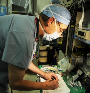 SOTO CANO AIR BASE, Honduras -- Lt. Col. Frank Stoecker, Joint-Task Force-Bravo Medical Element anesthetist, calculates medications for a patient preparing to undergo surgery at the Santa Teresa Hospital in Comayagua. The JTF-Bravo MEDEL surgical team assisted local surgeons Mar. 10 during a Medical Readiness Training Exercise. JTF-Bravo participates in approximately two local MEDRETEs per week in addition to 24 large-scale MEDRETES per year, providing nearly 32,000 Honduran citizens with healthcare they might not otherwise receive. (U.S. Air Force photo/Staff Sgt. Kimberly Rae Moore)