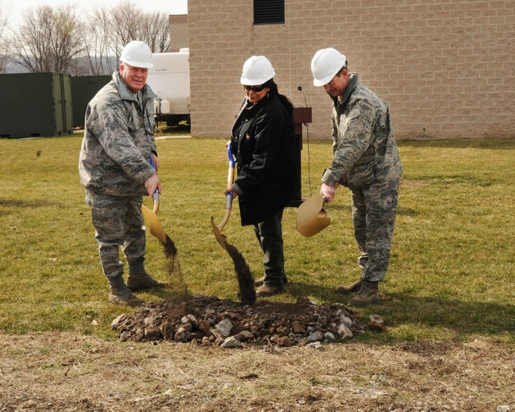 Brig. Gen. Eric G. Weller, Commander, 193rd Special Operations Wing, Darcia North Wind, President, Northwind Engineering and Col. David J. Smoker, Commander, 193rd Mission Support Group turn the first shovels of dirt at the groundbreaking ceremony, Tuesday, Mar. 15, 2011, for the two new buildings to be built at the 193rd in Middletown, Pa. Air Force Special Operations Command approved funding for the construction of the Mission Support Kit Storage Building, which will be used to build, store and inspect deployable equipment for Commando Solo aviation tasking, as well as the Deployed Aircraft Ground Response Element (DAGRE) Training Facility, which will be utilized as a Security Forces training area for combat skills training, build-up and storage for rapidly deployable DAGRE team equipment and gear. (U.S. Air Force photo/Staff Sgt. Mariko O. Bender)