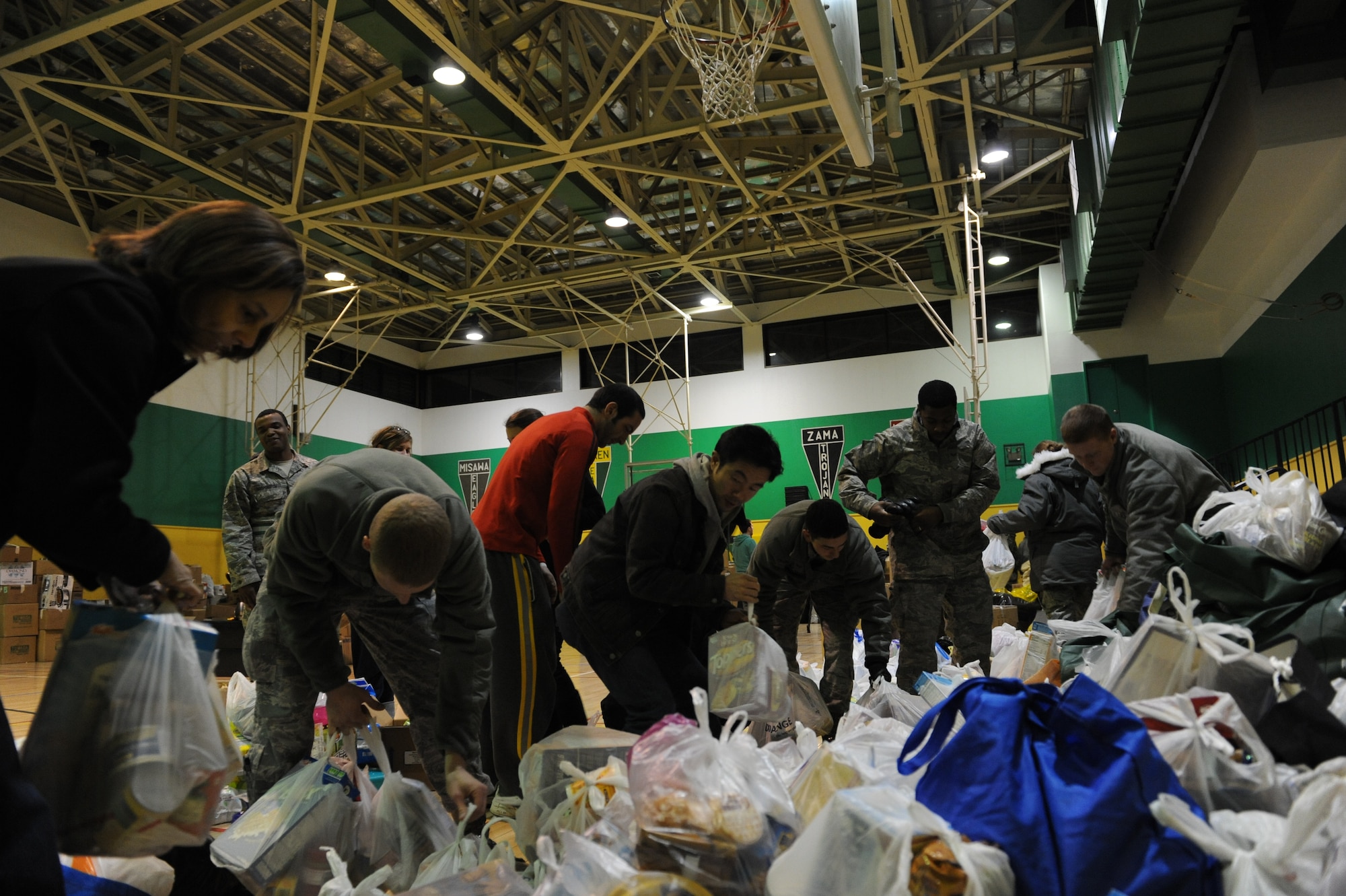 MISAWA AIR BASE, Japan – A combined effort of Misawa residents and Teachers from Mey Sen Academy, Sendai, Japan, load donations of clothes, food and blankets on a truck, in support of Operation Tomodachi Mar. 16.  The supplies will be distributed to the communities that were affected by the earthquake and tsunami.  (U.S. Air Force Tech. Sgt. Russell J. McBride\Released)