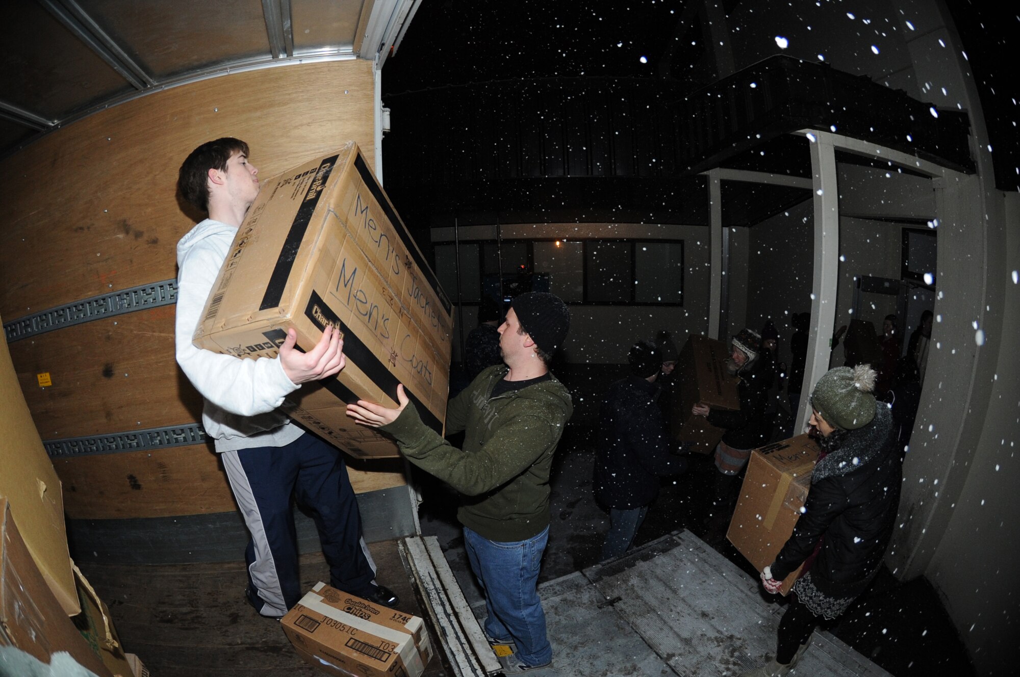 MISAWA AIR BASE, Japan - Teachers from Sendai team-up with Misawa residents to load over 1,000 lbs of supplies donated by the families of Misawa Air Base Mar. 16.  The supplies were driven south to Sendai to help those affected by the earth quake and tsunami.  (U.S. Air Force Staff Sgt. April Quintanilla\Released)