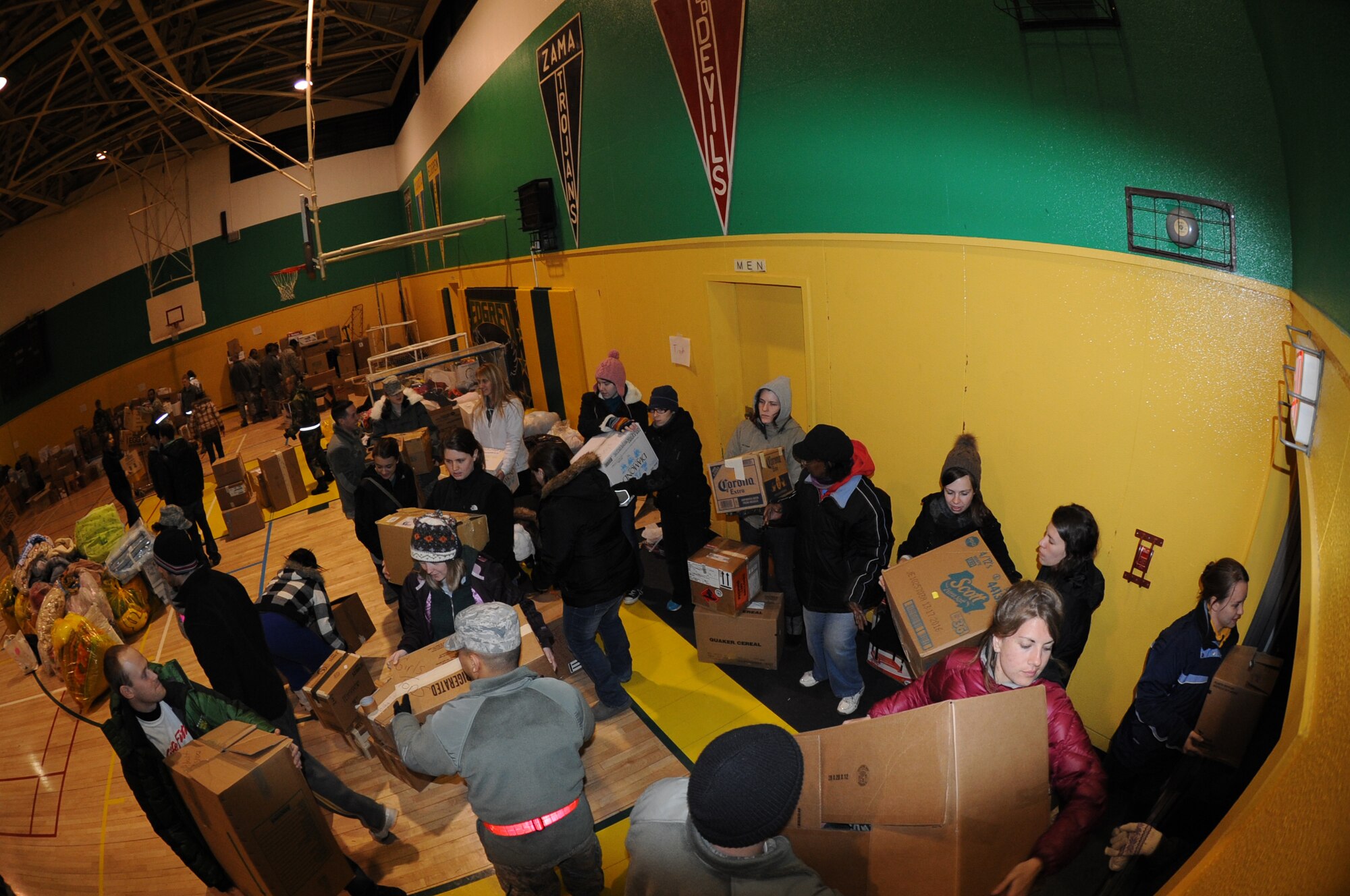 MISAWA AIR BASE, Japan - Teachers from Sendai team-up with Misawa residents to load over 1,000 lbs of supplies donated by the families of Misawa Air Base Mar. 16.  The supplies were driven south to Sendai to help those affected by the earth quake and tsunami.  (U.S. Air Force Staff Sgt. April Quintanilla\Released)