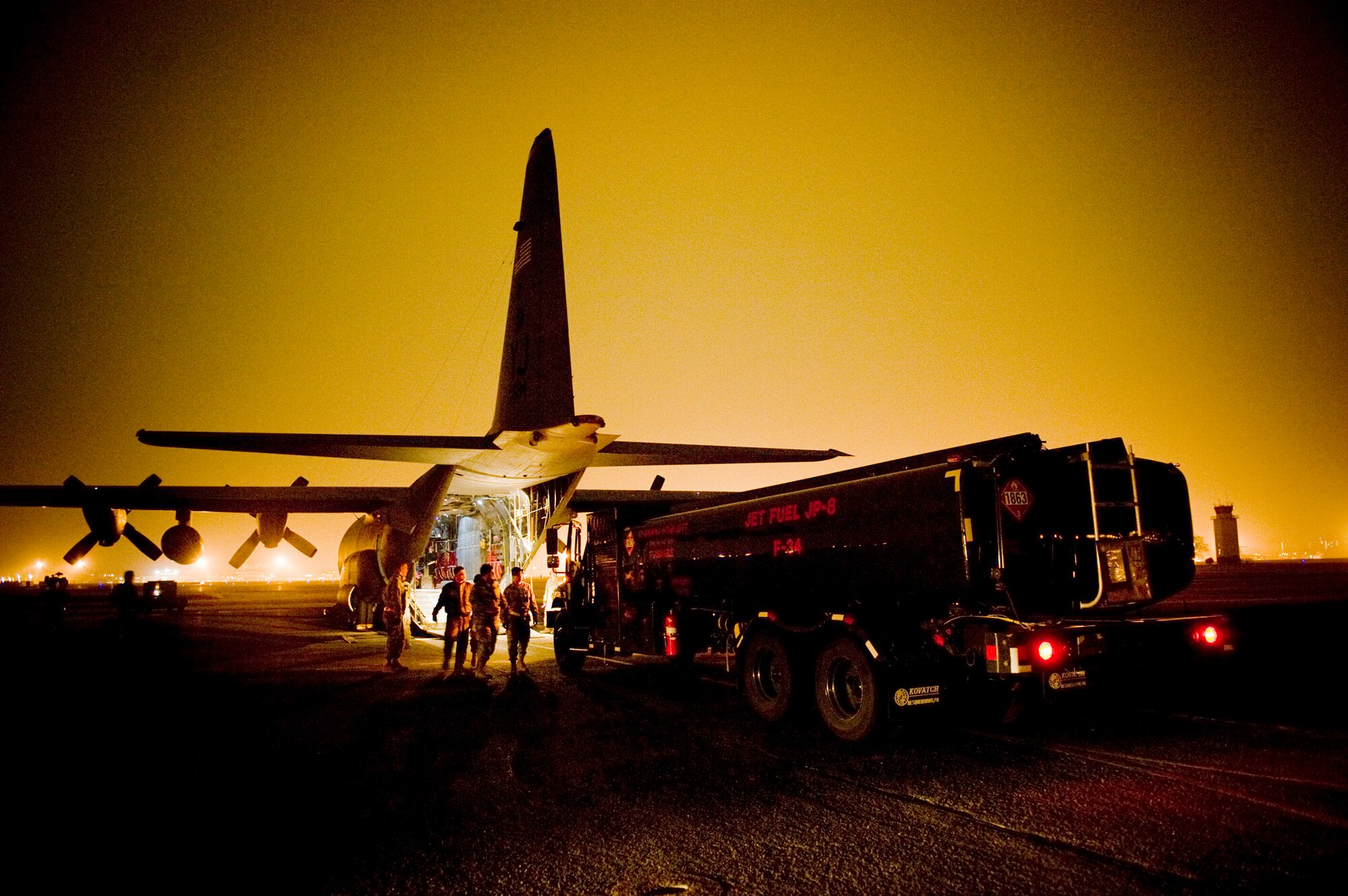 A fuels truck pulls up to an C-130H Hercules to be loaded here March 15. The fuels truck was taken to Yamagota Airport to support Japan's earthquake and tsunami relief efforts. (U.S. Air Force photo/Staff Sgt. Jonathan Steffen)