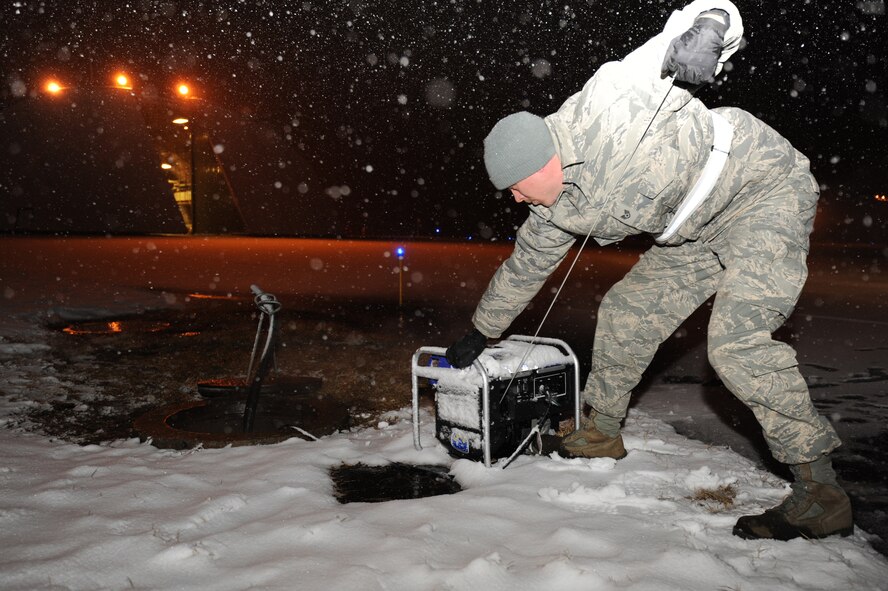 MISAWA AIR BASE, Japan - Staff Sergeant Matthew Nelson 35th Civil Engineer Squadron, starts the water pump to begin pumping water out of steam lines that has collected as a result of power loss due to the recent earth quake.  These steam lines run throughout the entire base and are used to supply the base with heat. (U.S. Air Force Staff Sgt. April Quintanilla\Released)