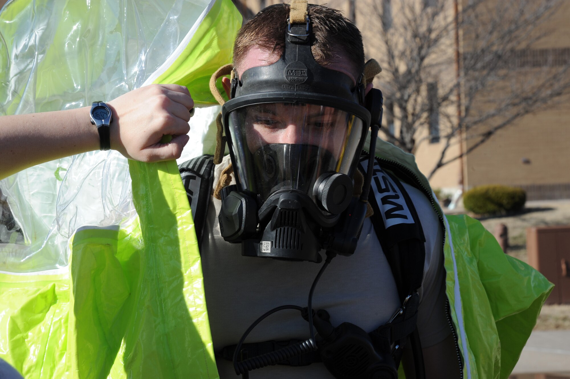 Staff Sgt. Randy Golleher, 22nd Civil Engineer Squadron emergency management craftsman, dons a level-A hazardous materials suit during major accident response exercise scenario, March 10, 2011, McConnell Air Force Base, Kan. During the MARE scenario, Airman responded to a possible HAZMAT spill, which occurred after a tornado “hit” the base. McConnell Airmen are tested regularly on their ability to respond to natural disasters. (U.S. Air Force photo/Staff Sgt. Dallas Edwards)