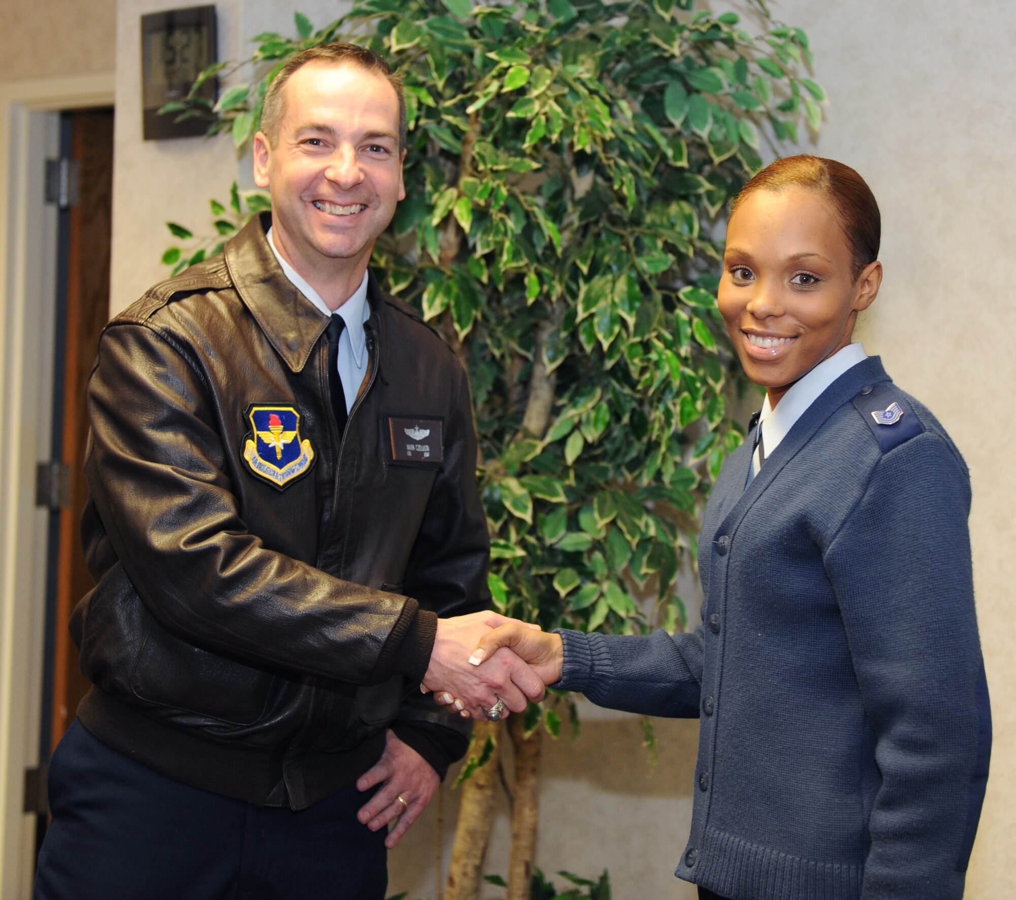 Col. Mark Czelusta, 314th Airlift Wing commander, presents a coin March 14, 2011, to Tech. Sgt. Monica Hood, 314th Maintenance Group knowledge operations noncommissioned officer in charge, at Little Rock Air Force Base, Ark. Sergeant Hood ensured an “Excellent” rating during the recent 314th Airlift Wing Unit Compliance Inspection, the first Electronic Records Management “Excellent” in Air Education Training Command during the past year.  (Air Force photo by Airman 1st Class Ellora Stewart)