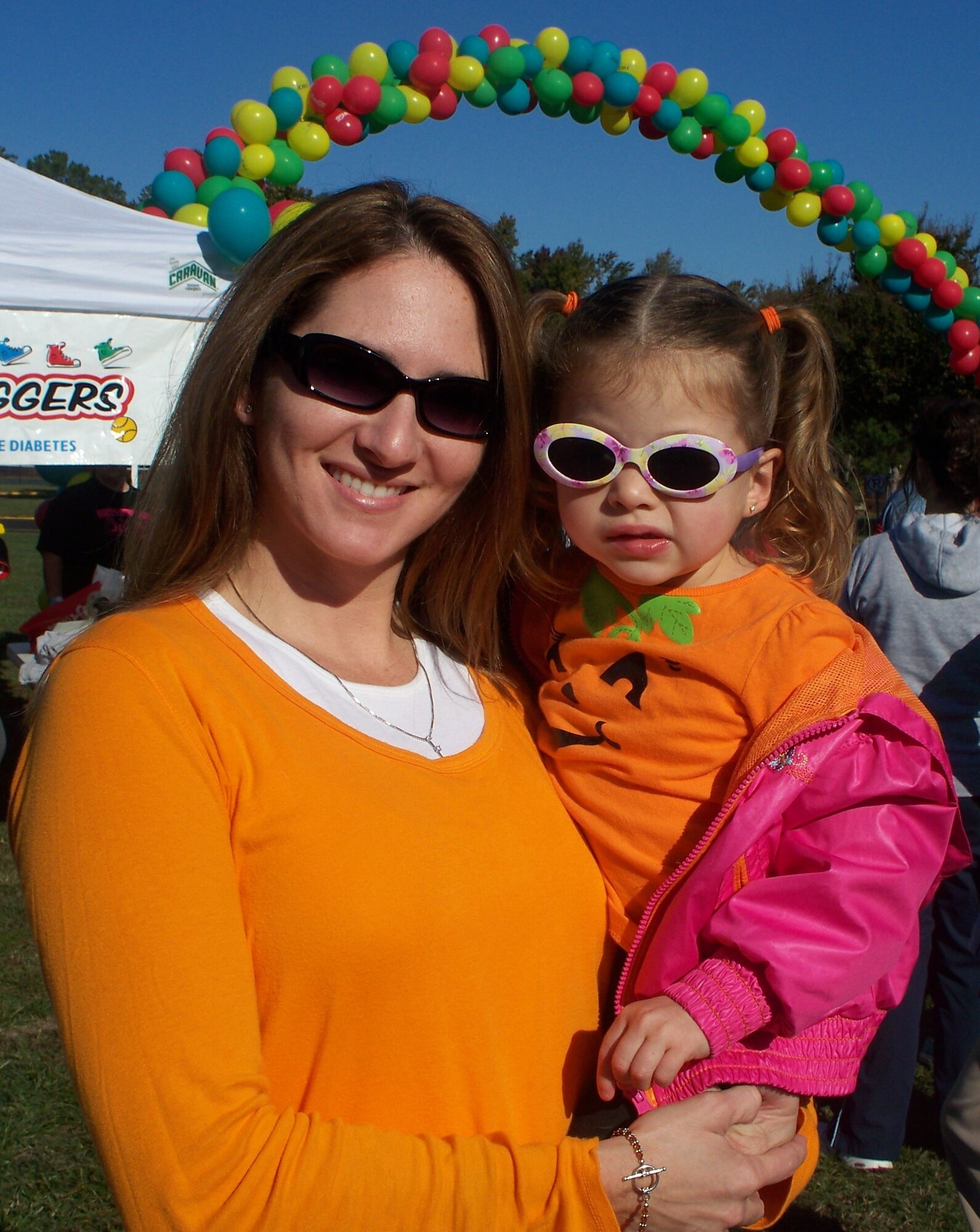 Master Sgt. Chelesa Wilds, 1st Maintenance Operations Squadron NCO in charge of  Instructional Systems Development at Langley Air Force Base, Va., enjoys a day in the sun with 3-year-old daughter, Kamdyn, at the Juvenile Diabetes Association Walk to Cure Diabetes in October 2010. Sergeant Wilds speaks out about the challenges of raising a diabetic child and encourages parents who may facec similiar circumstances. (Courtesy photo)