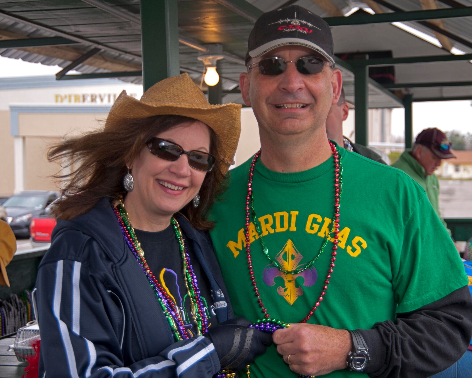 Brig. Gen. James Muscatell, 403rd Wing commander and his wife, Nancy, pose for a photo on the City of D'Iberville's float before the annual Mardi Gras parade kicked off March 6 in D'Iberville, Miss.  General and Mrs. Muscatell were asked by the city to represent the 403rd Wing, Keesler Air Force Base, Miss.  (U.S. Air Force photo by Tech. Sgt. Tanya King)