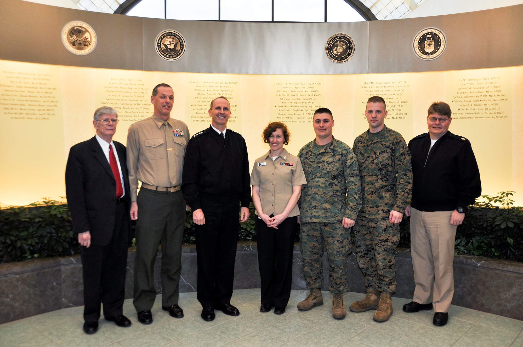 Navy and Marine Corps Liaisons and the Marine Corp chaplain assigned to Air Force Mortuary Affairs Operations, pose with Admiral Jonathan W. Greenert, Vice Chief of Naval Operations, March 11, 2011 during his visit to the Charles C. Carson Center for Mortuary Affairs. (U.S. Air Force photo/Christin Michaud)