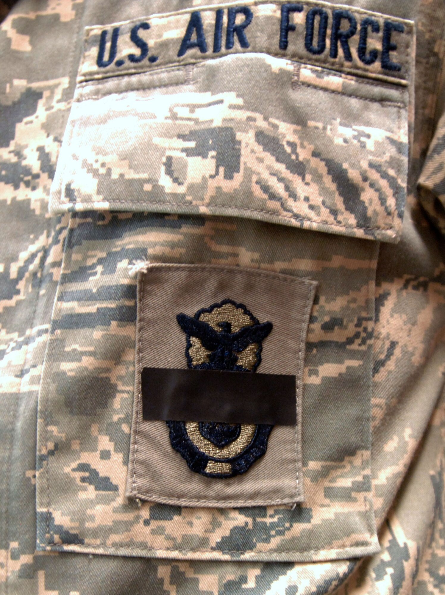 The 633d Security Force Squadron at Langley Air Force Base, Va., wears
black tape over their shield in mourning for Senior Airman Nicholas J.
Alden,who was killed en route to Afghanistan March 2, 2011. The display is a
time-honored tradition within the law enforcement community, as a symbolic
gesture for officers killed in the line of duty. (U.S. Air Force
photo byAirman 1st Class Jason J. Brown/RELEASED) 
