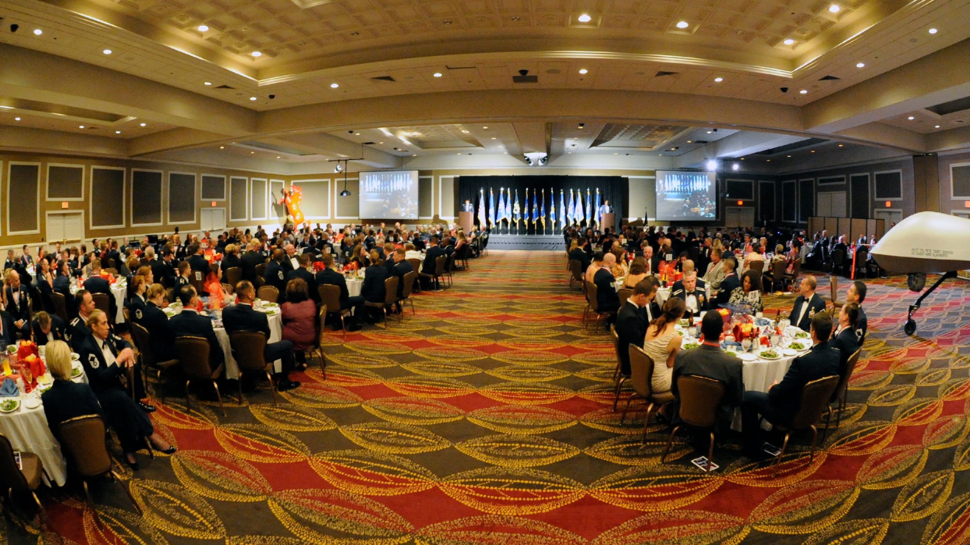 Guests of the12th Air Force (Air Forces Southern) Outstanding Performer of the Year banquet listen as the Masters of Ceremonies preview the night's festivities in Las Vegas Feb. 23.