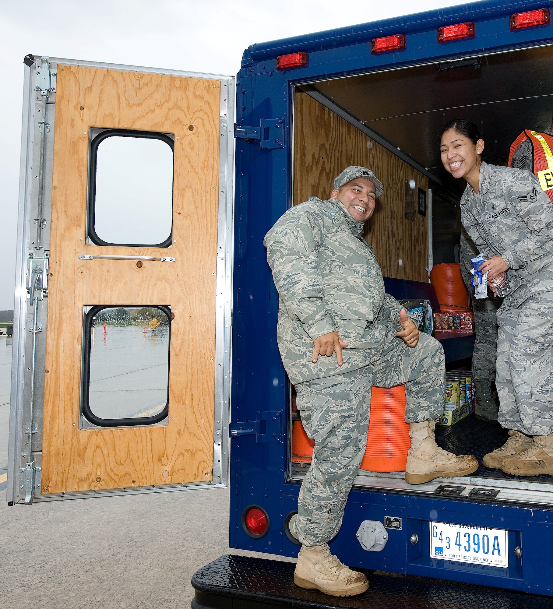 Chaplain (Capt.) Richard Rojas visits Airman 1st Class Rossmery Holyfield, 436th Medical Operations Squadron medical technician, in the iconic “Holy Roller” van at Dover Air Force Base, Del. The base chapel staff has spent more than 4,000 hours visiting members of Dover AFB and the community. (U.S. Air Force photo by Jason Minto)